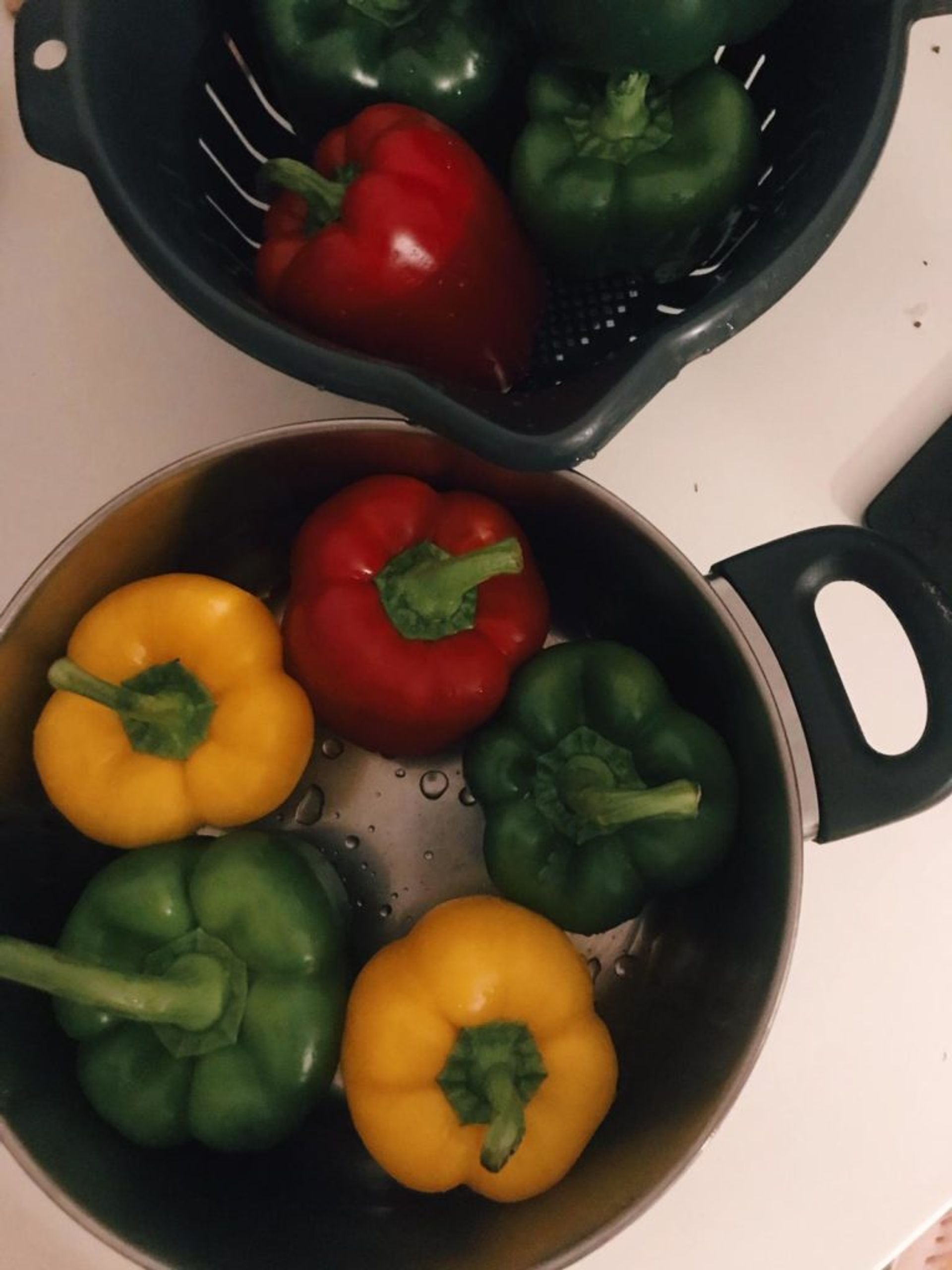 Close-up of peppers cooking in a pan.