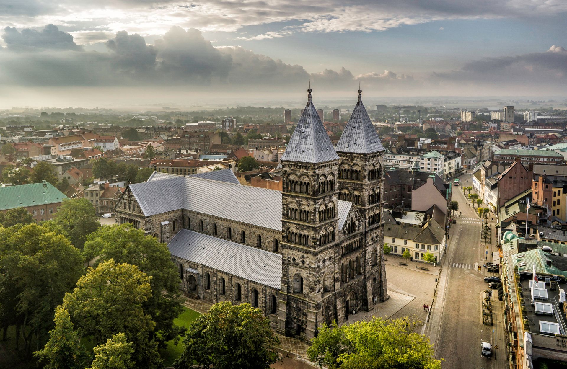 A shot of a large, brick cathedral taken from above.
