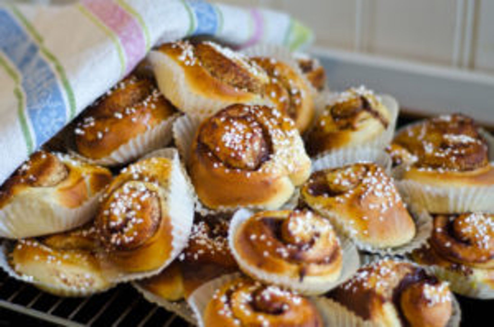 A tray filled with cinnamon buns.
