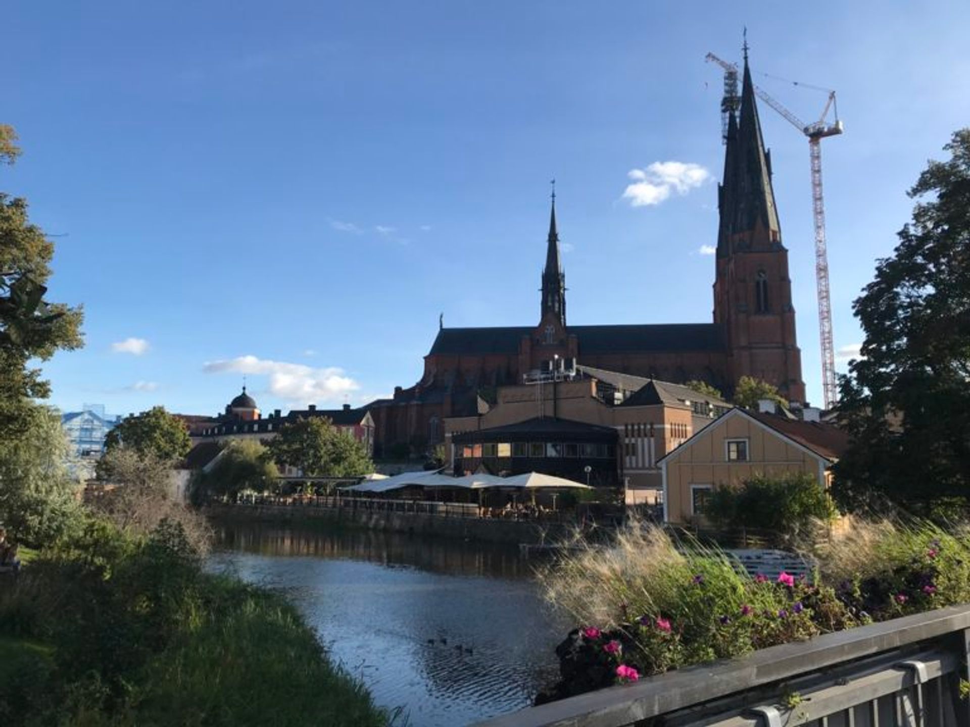 A cathedral beside a river.