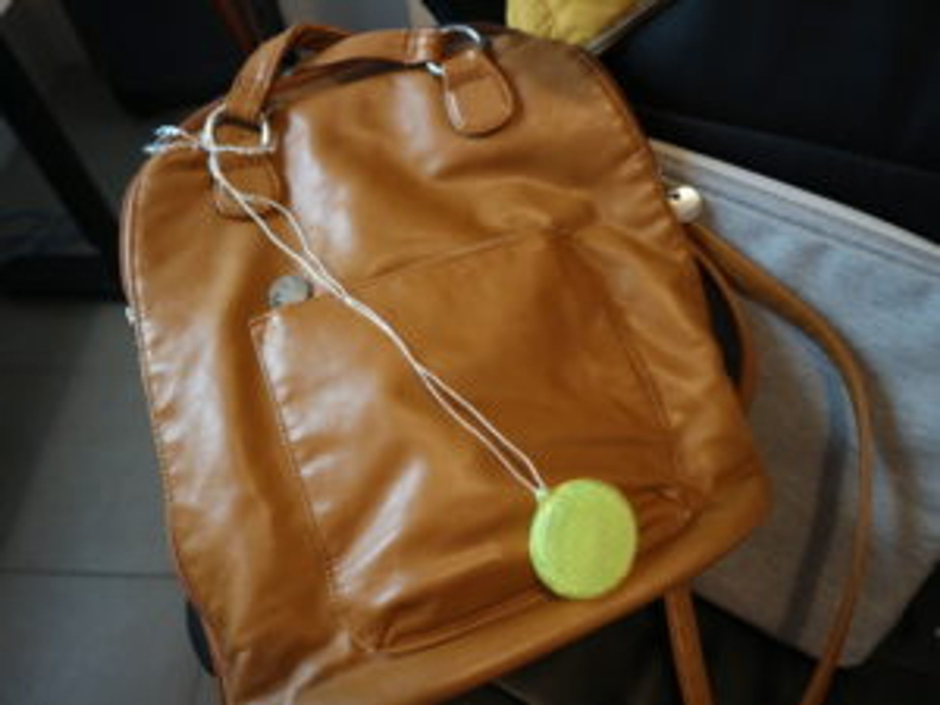 Close-up of a reflector attached to a bag.