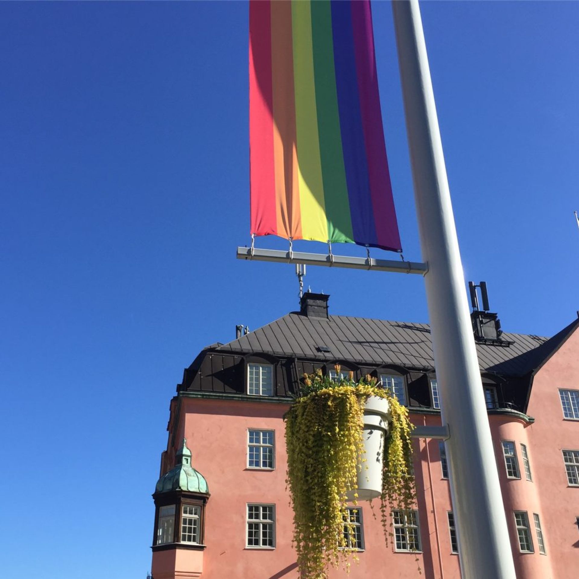 Pride flag and pink building in Uppsala 