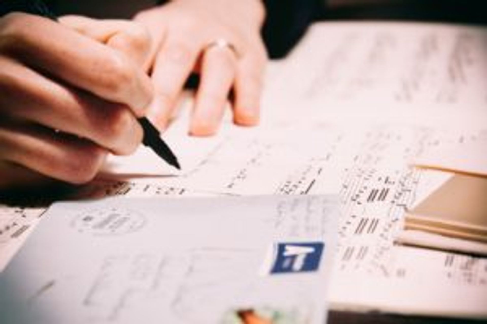 Close-up of a person writing a hand-written letter.