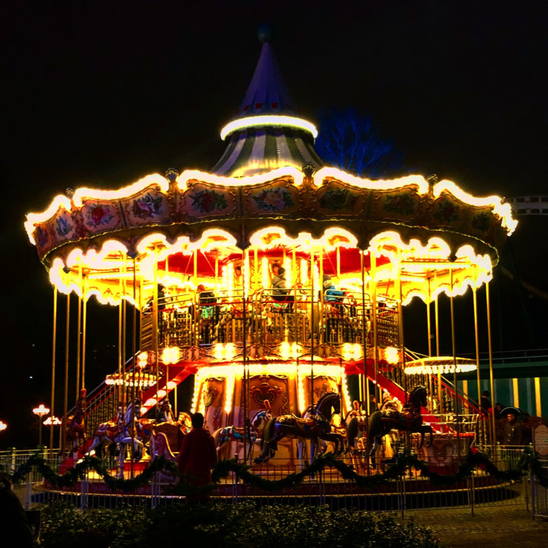 A carousel lit up at night.