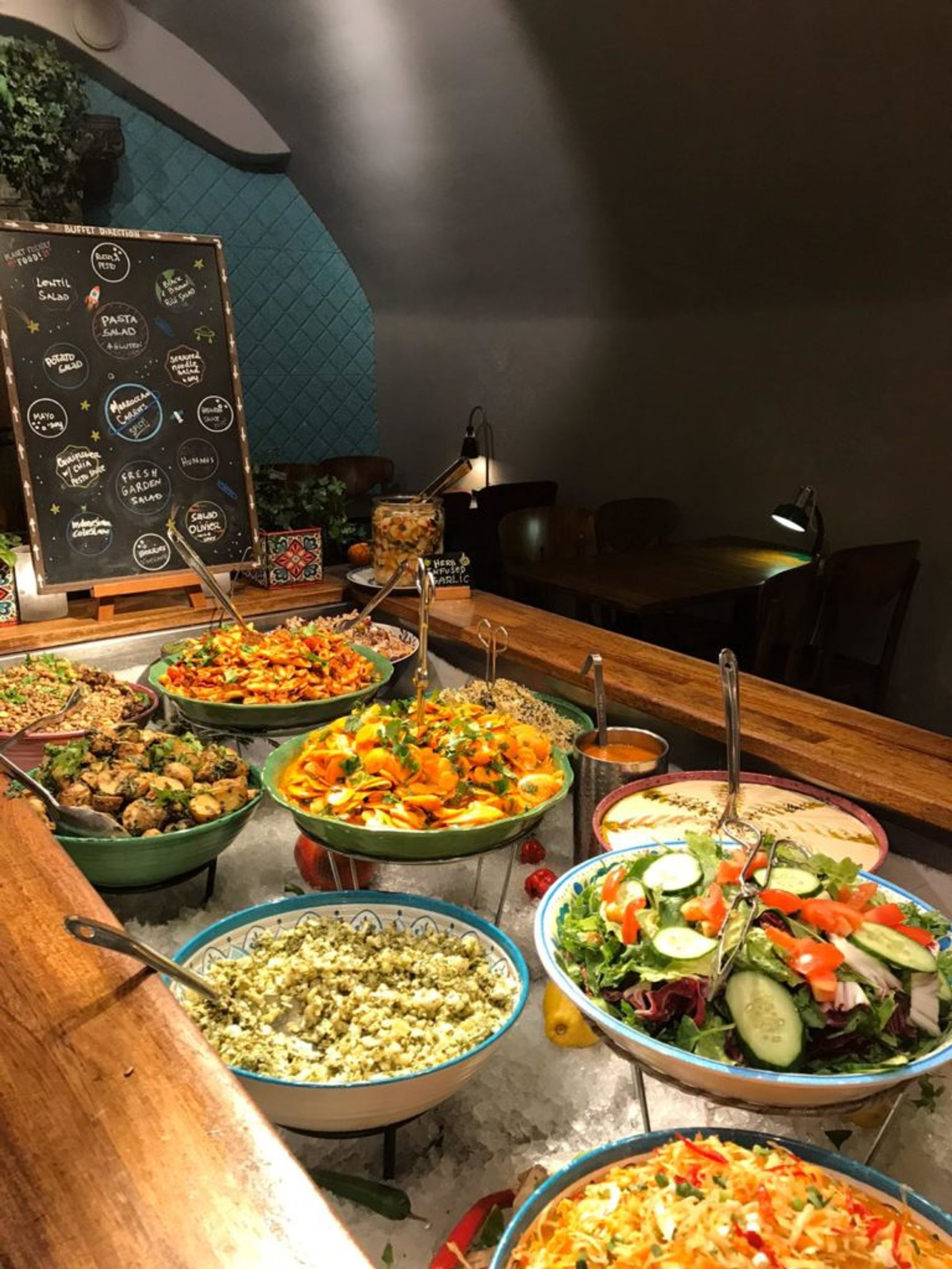 Large bowls of cold salads and dips.