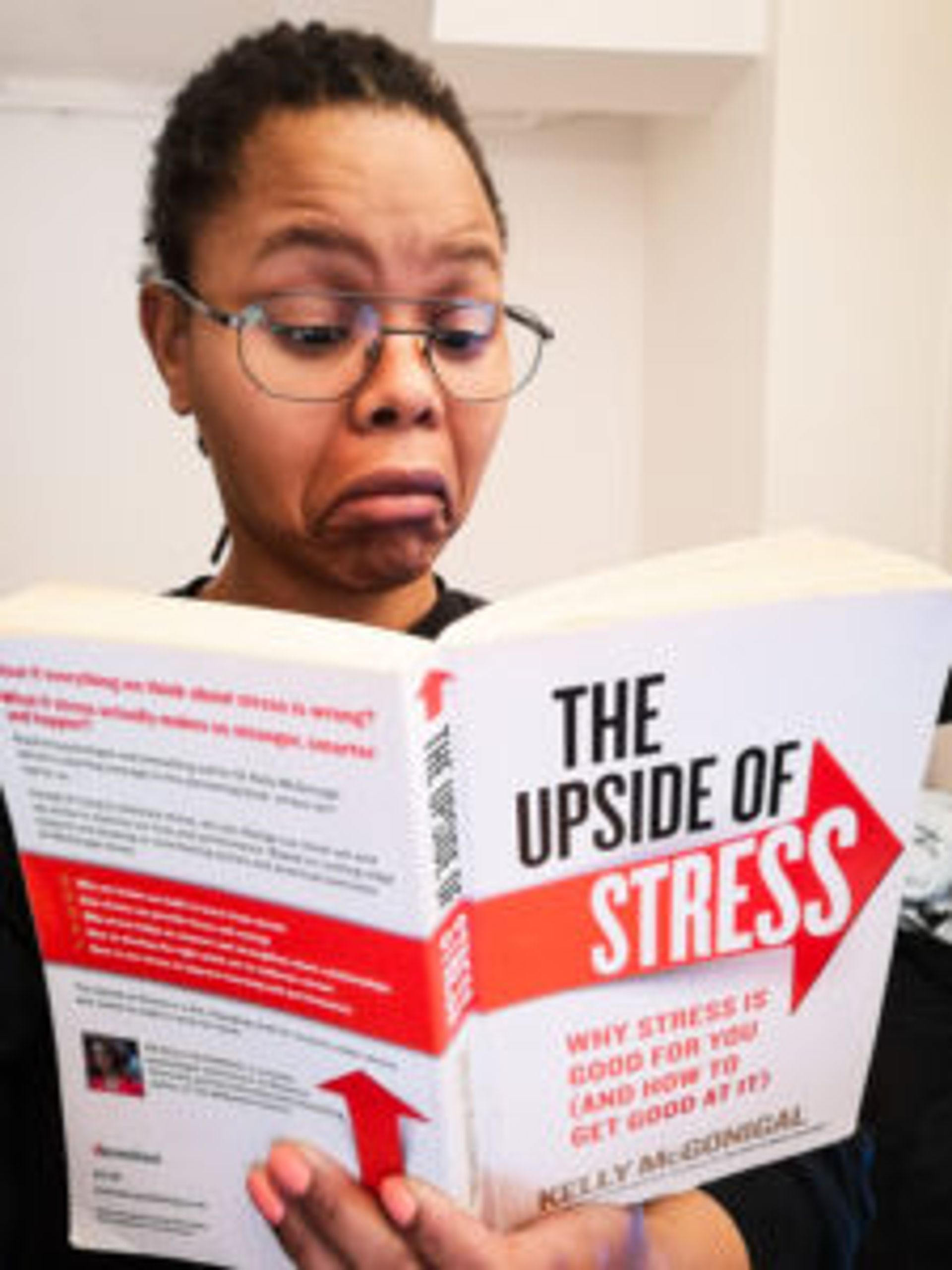 Lusanda reading the book, 'The upside of stress'.