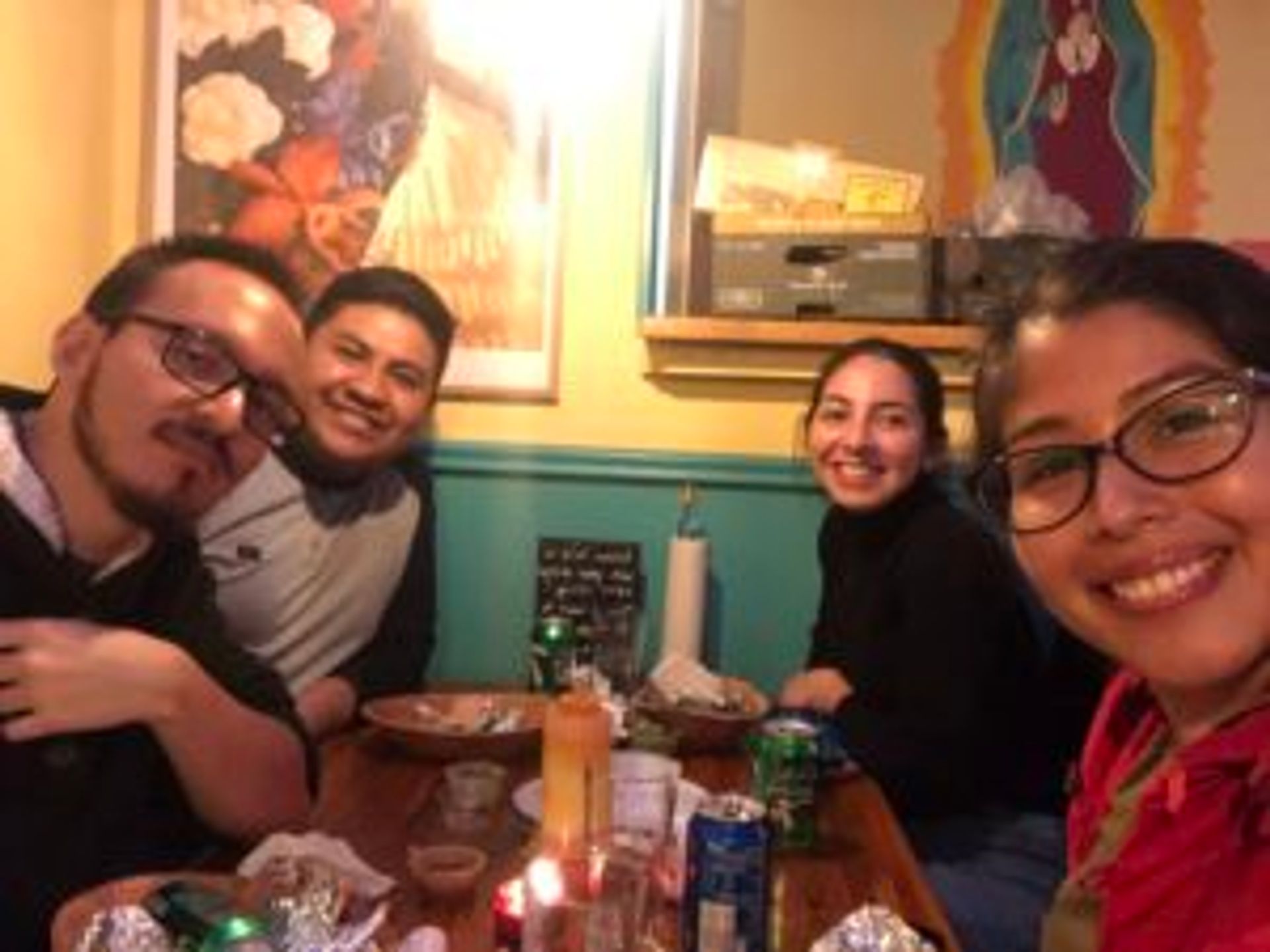 Camilo eats dinner with three friends at a Mexican restaurant.