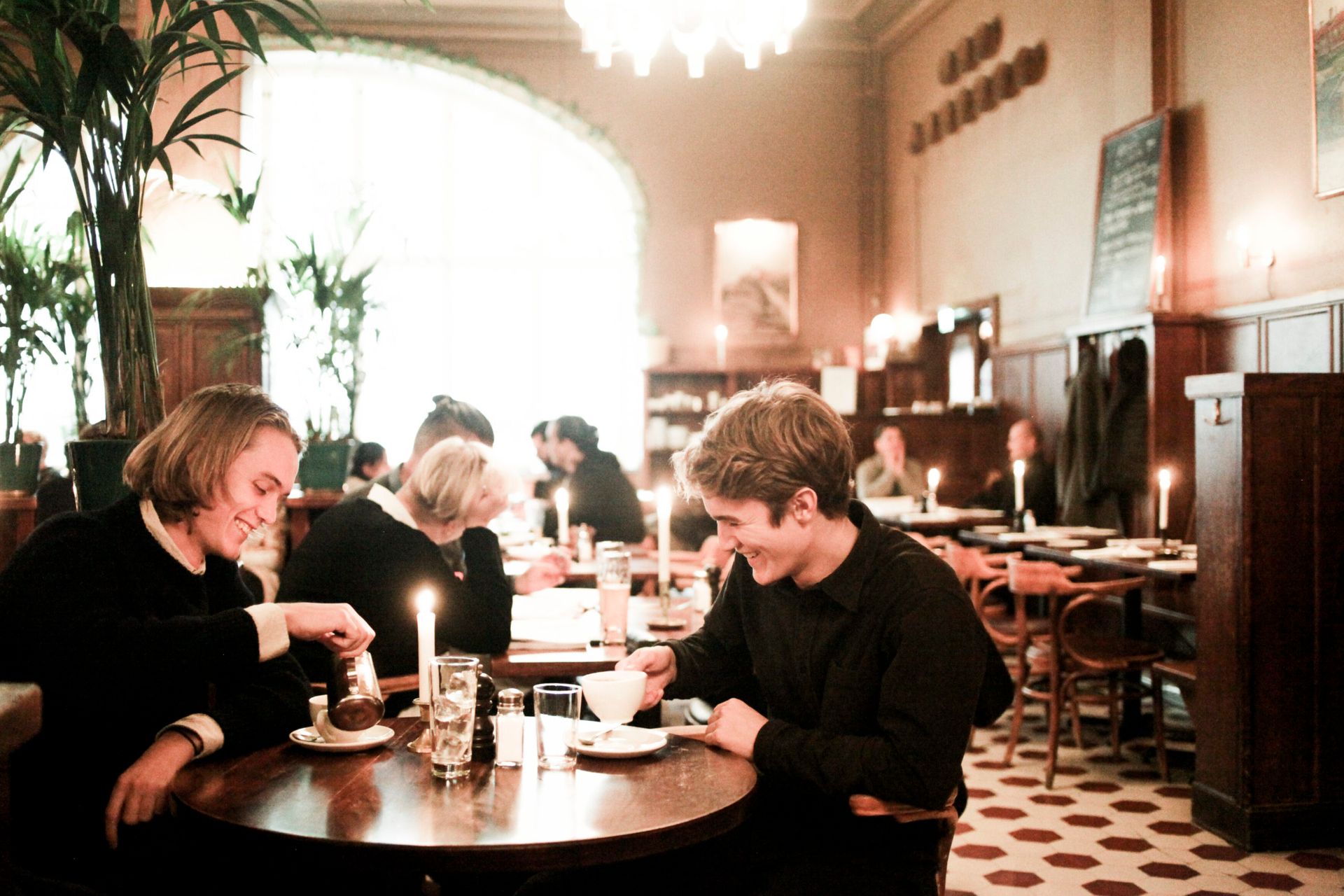 A couple enjoy dinner together in a restaurant.