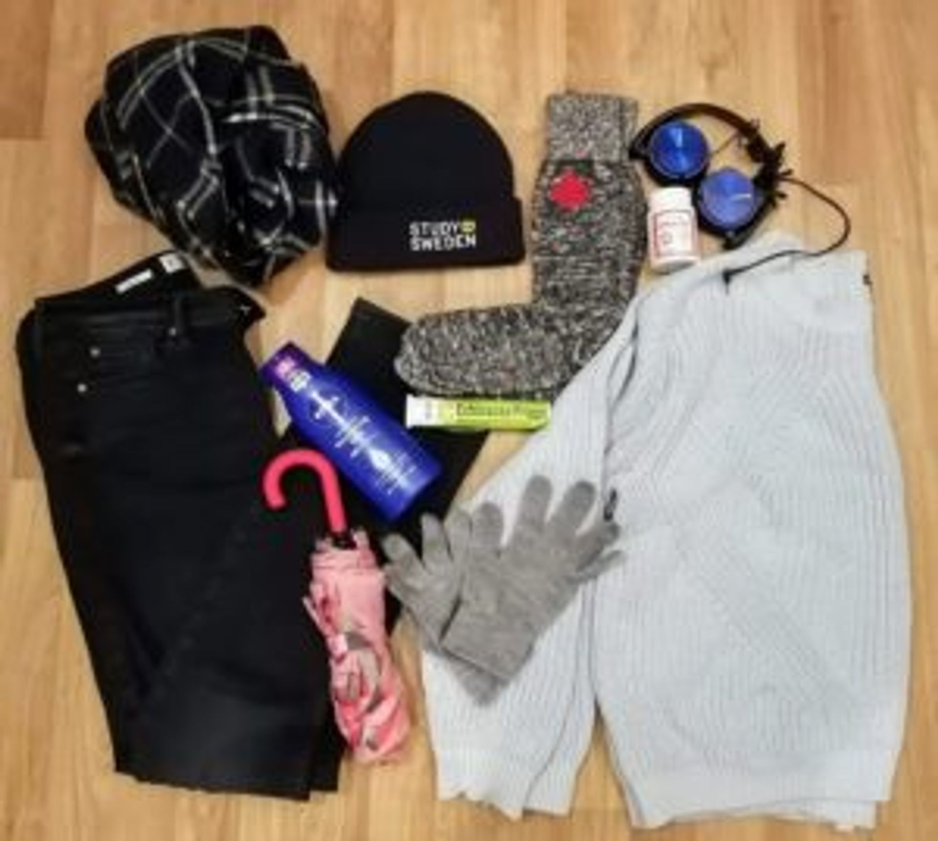 A winter survival kit. A knitted jumper, jeans, gloves, thick socks, scarf and hat.