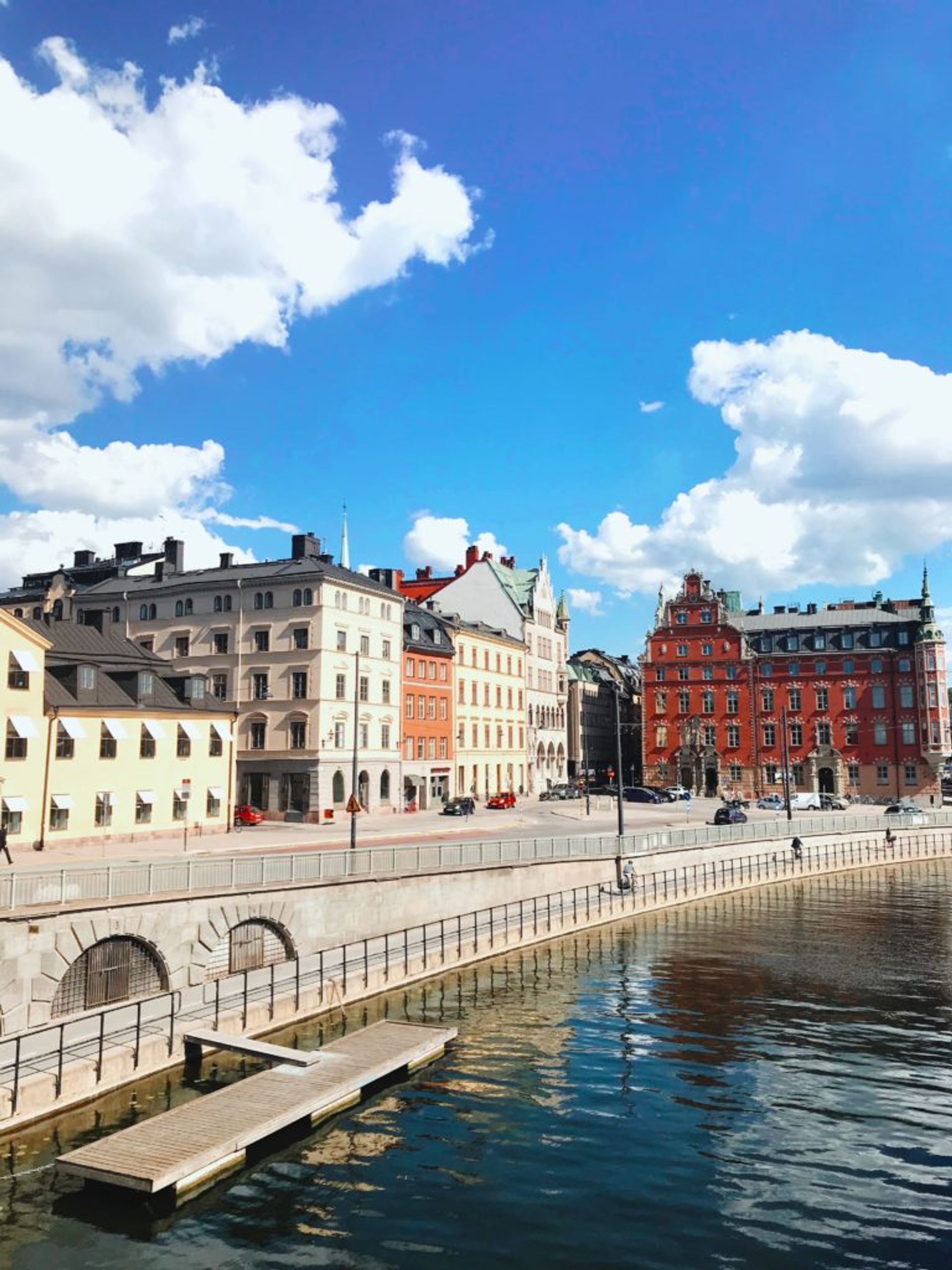 Red, white and cream coloured buildings in central Stockholm.