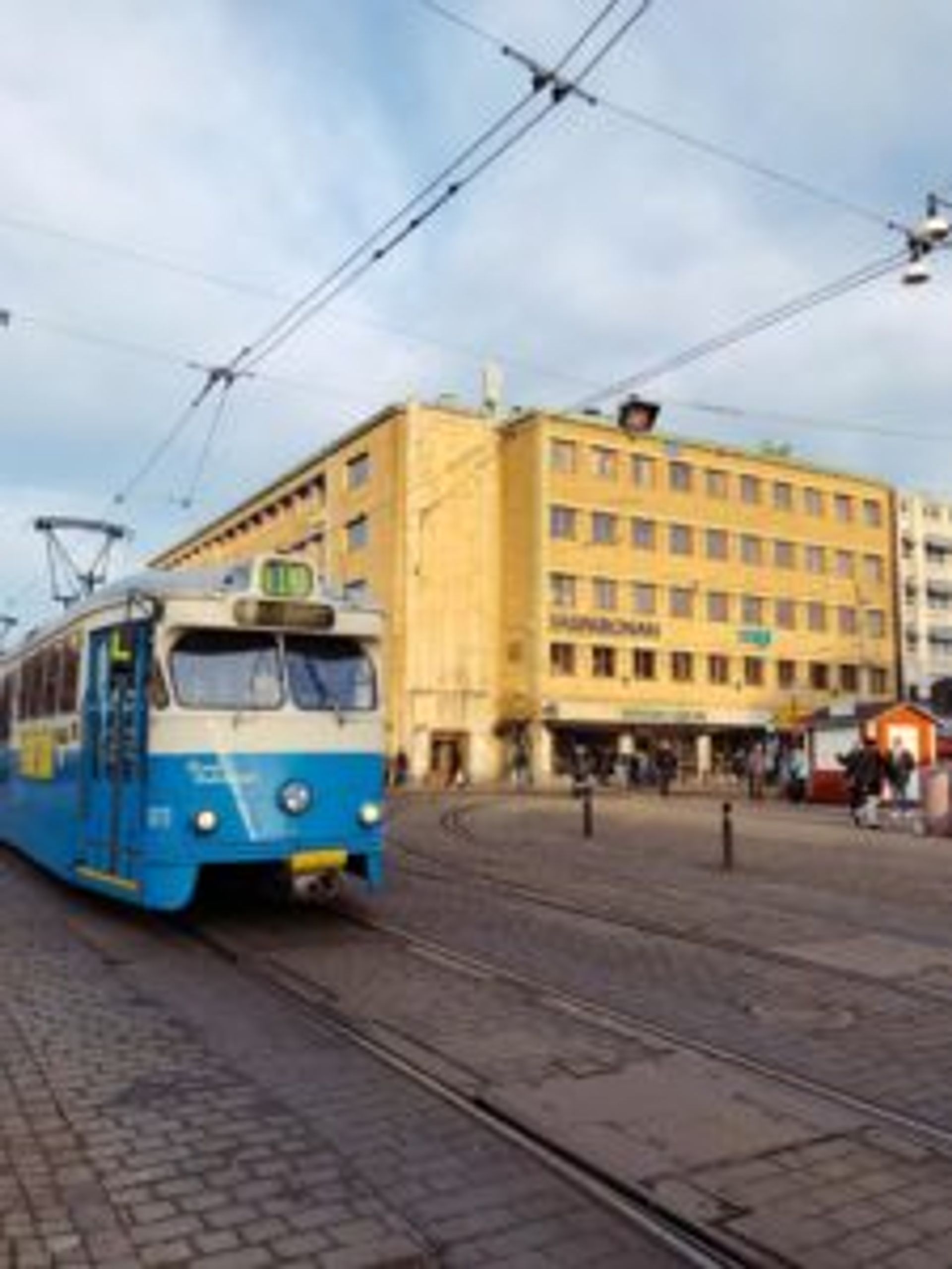 A blue and cream tram.