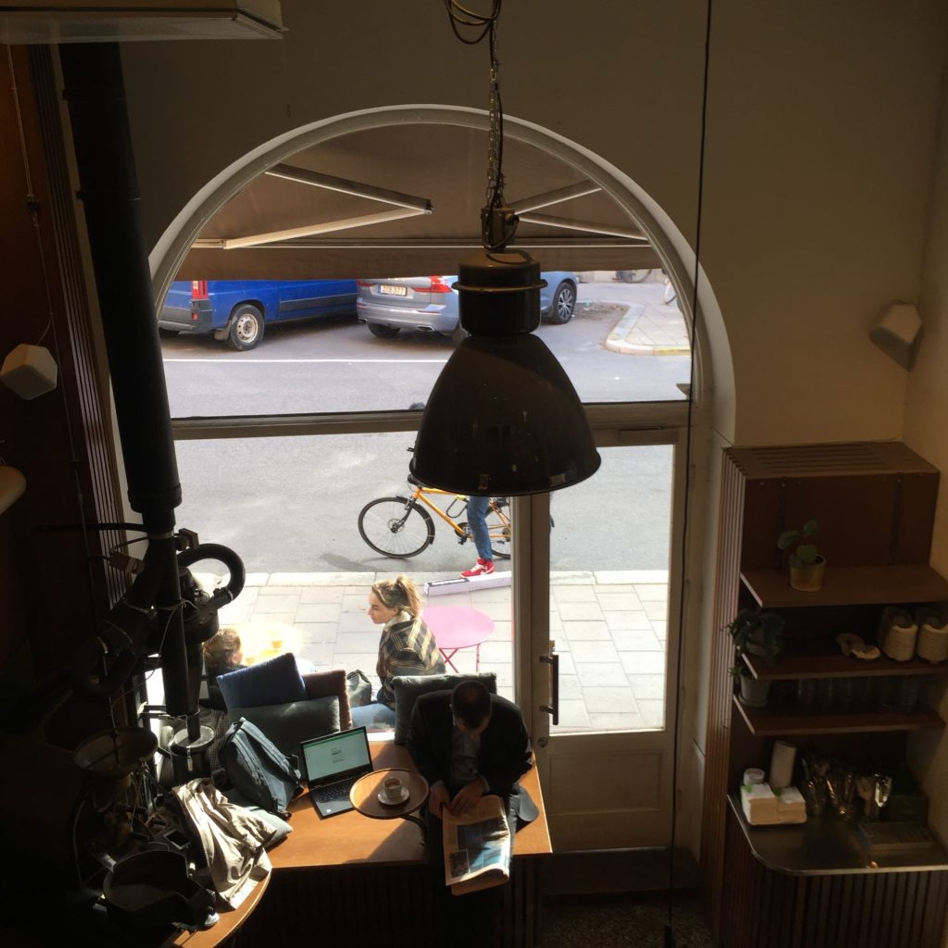A person sits and reads in the Johan och Nyström café.