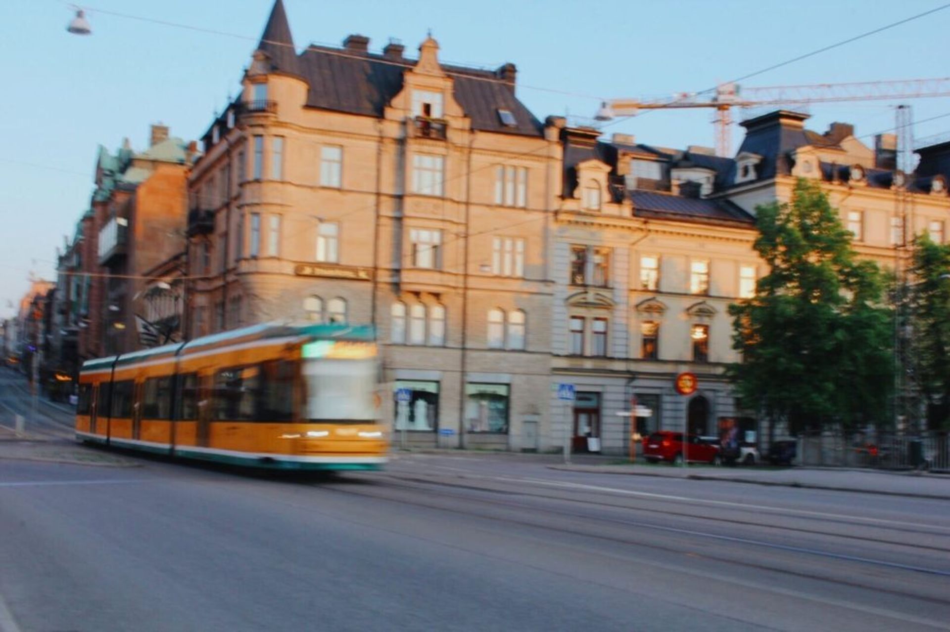 A yellow and green tram.