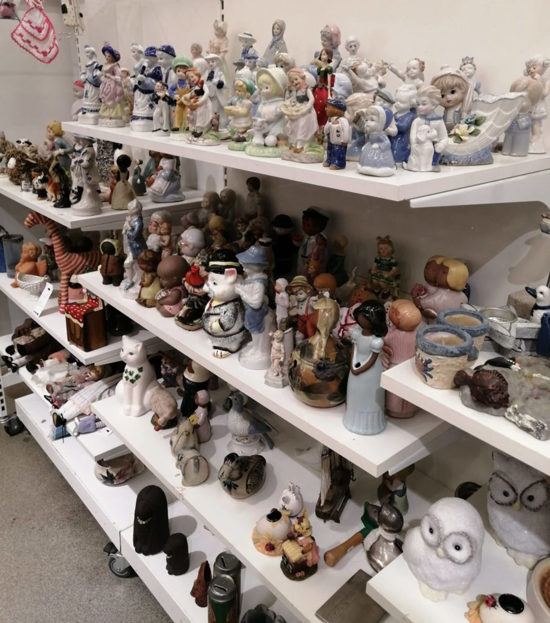 Shelves of ceramic figurines.