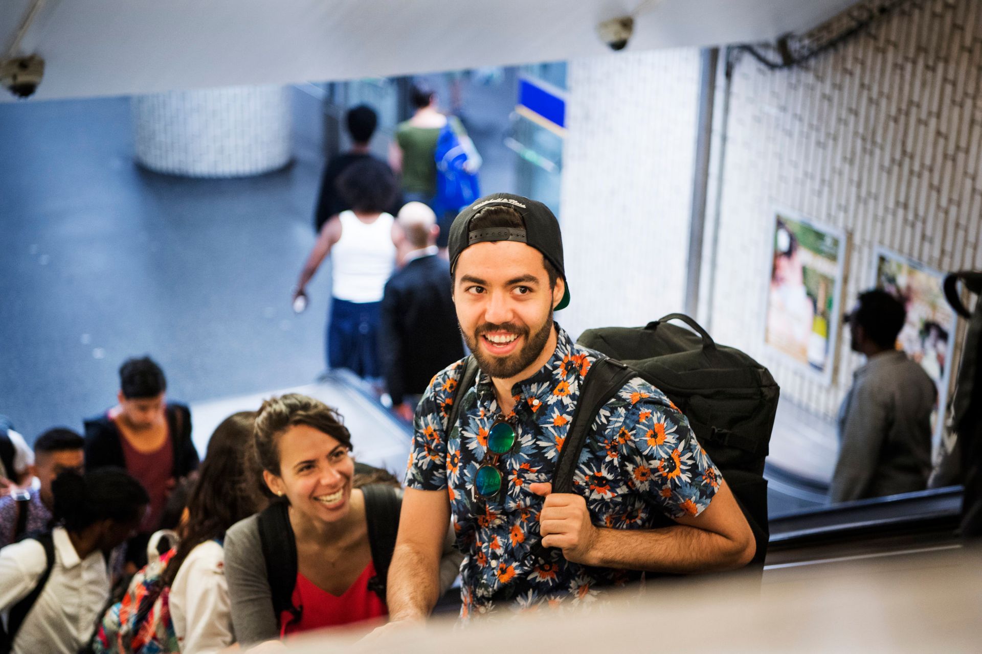 People standing on an escalator in the Stockholm metro.