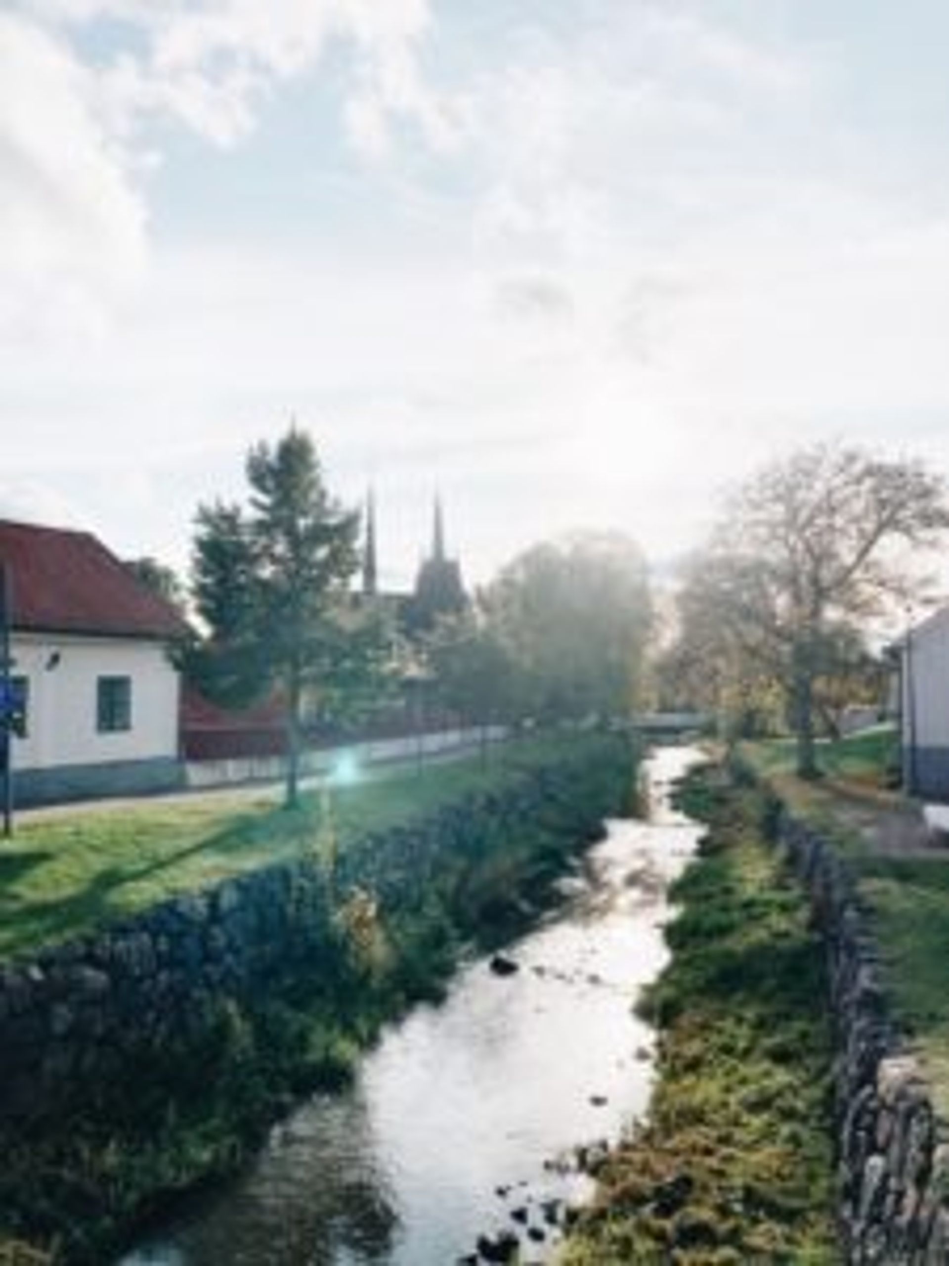 A stream beside a church.