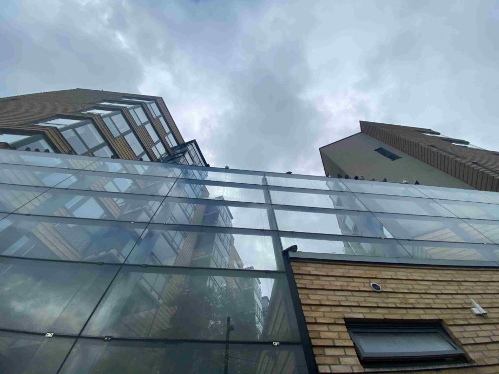 A glass wall outside of residential building.