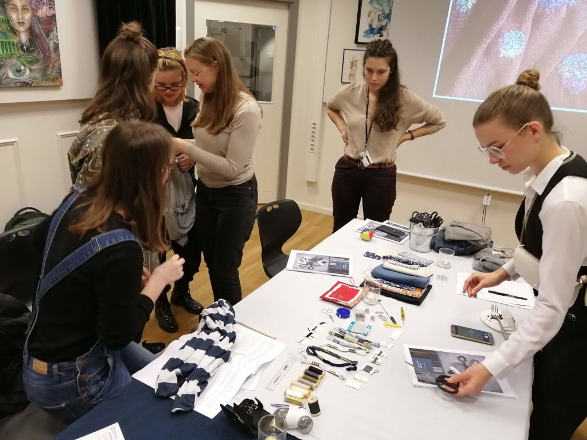 Students busy mending clothes.