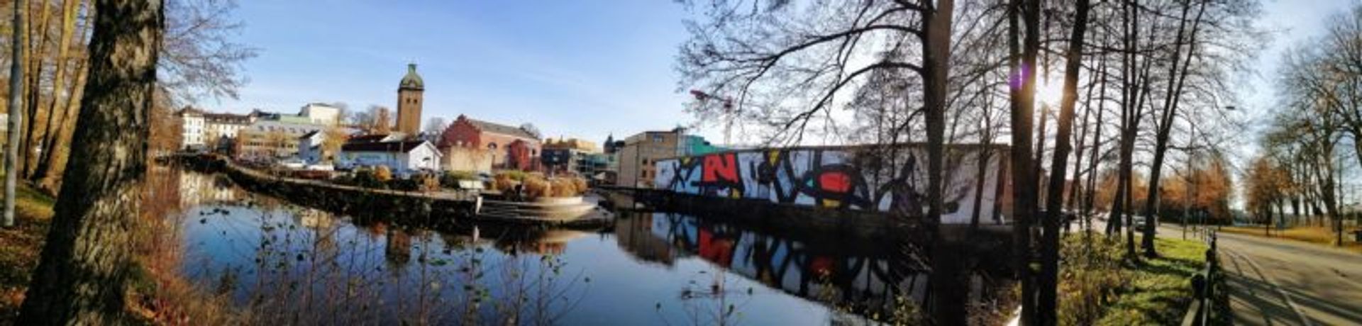 Panoramic view of Borås cityscape with colourful abstract mural by JM Rizzi.