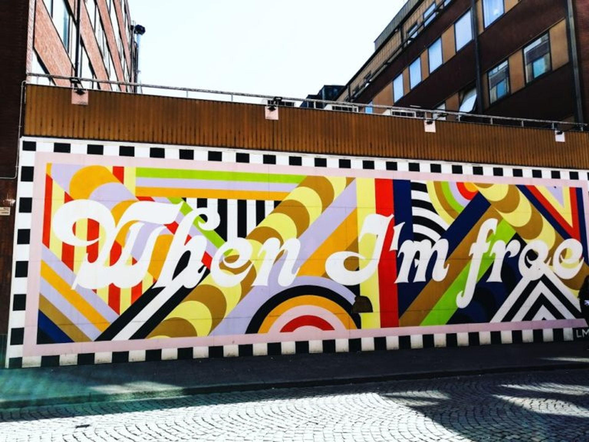 Boldly coloured mural with text 'When I'm free'.