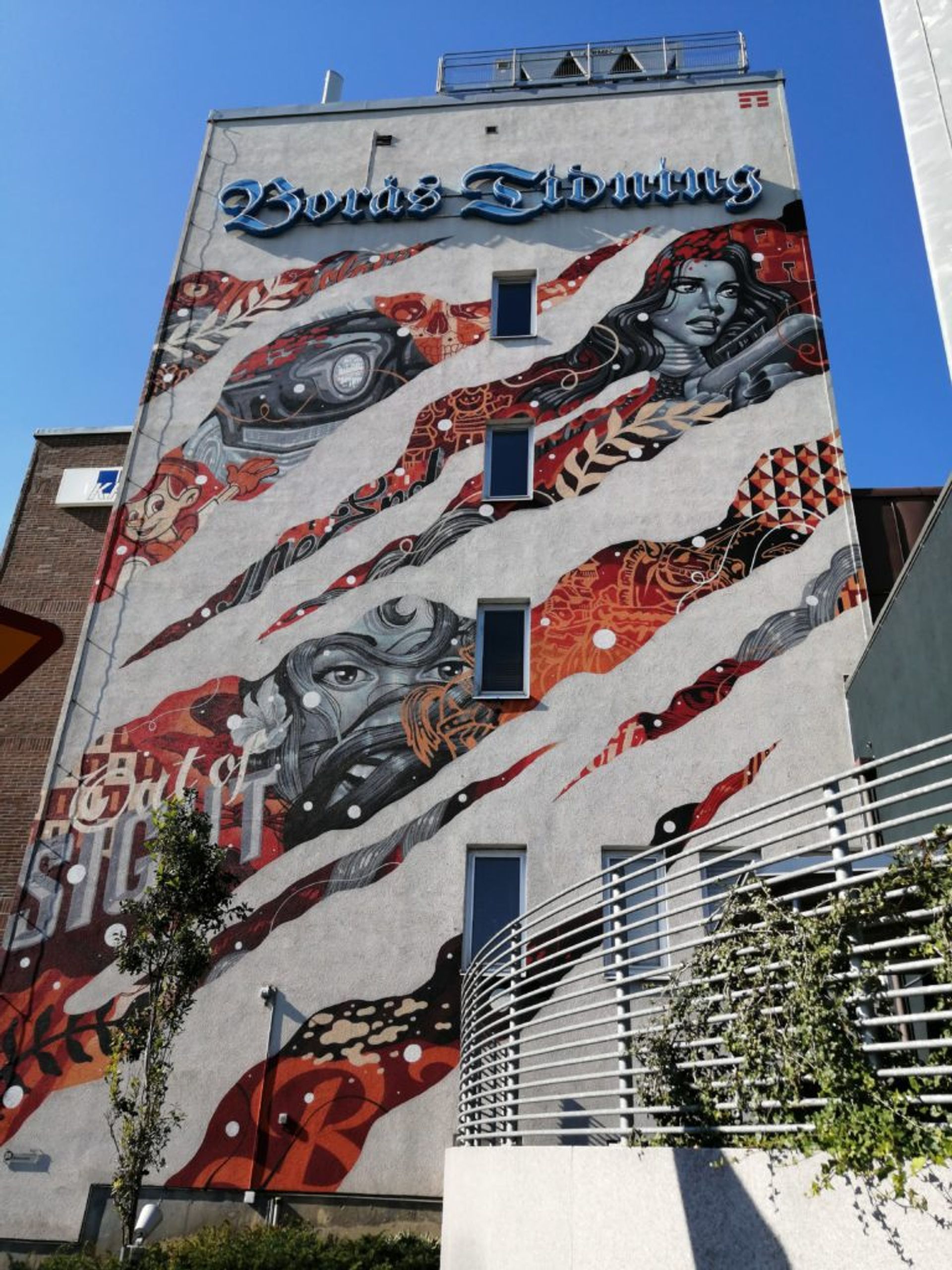 Graphic comic book inspired mural on the side of the Borås newspaper office building.