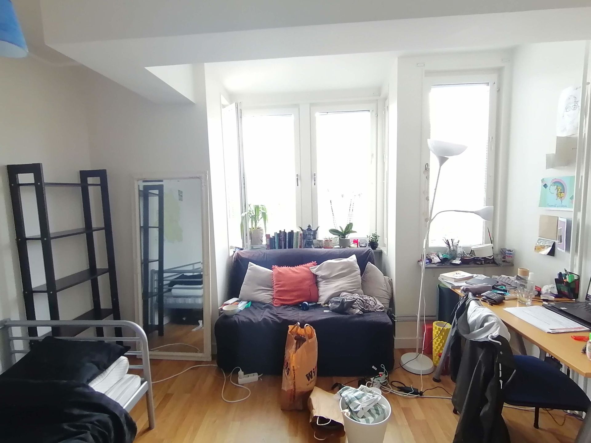 A cluttered studio apartment