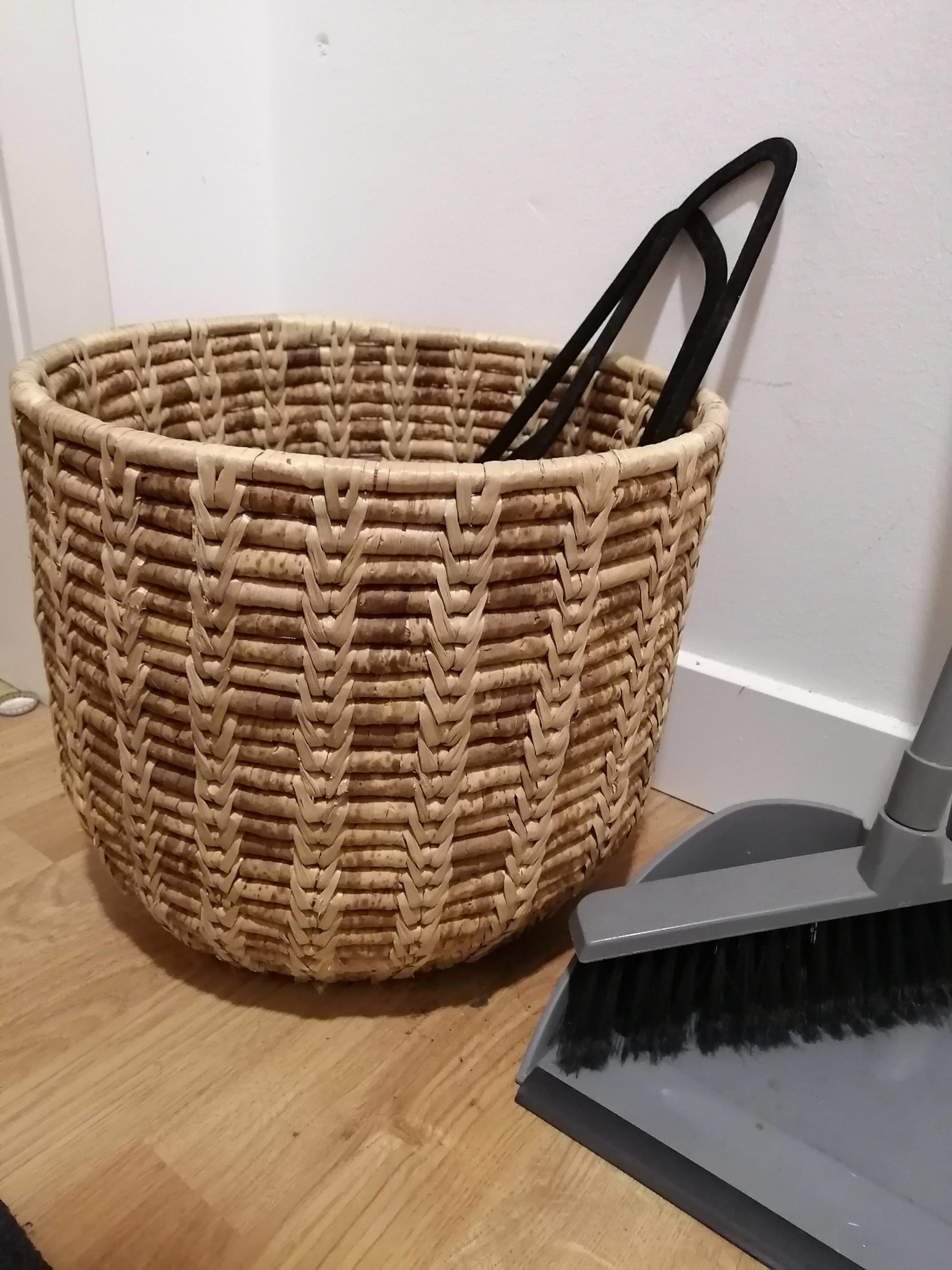 A wicker basket and broom