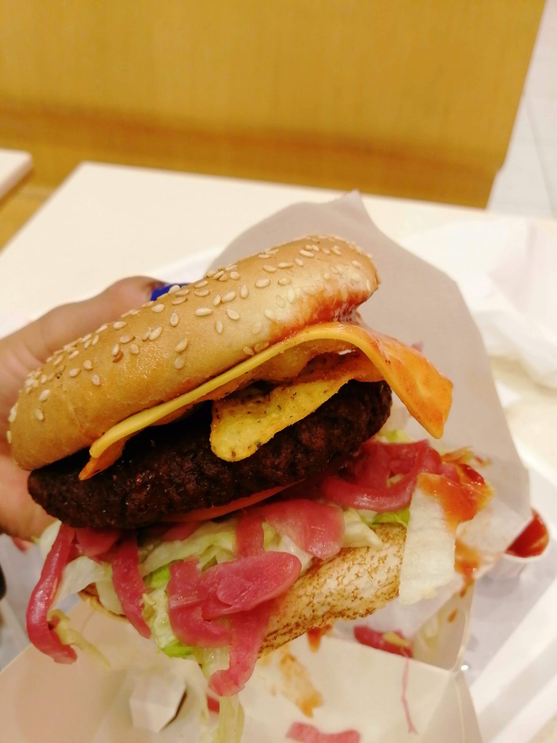 A take-away burger in a wrapper