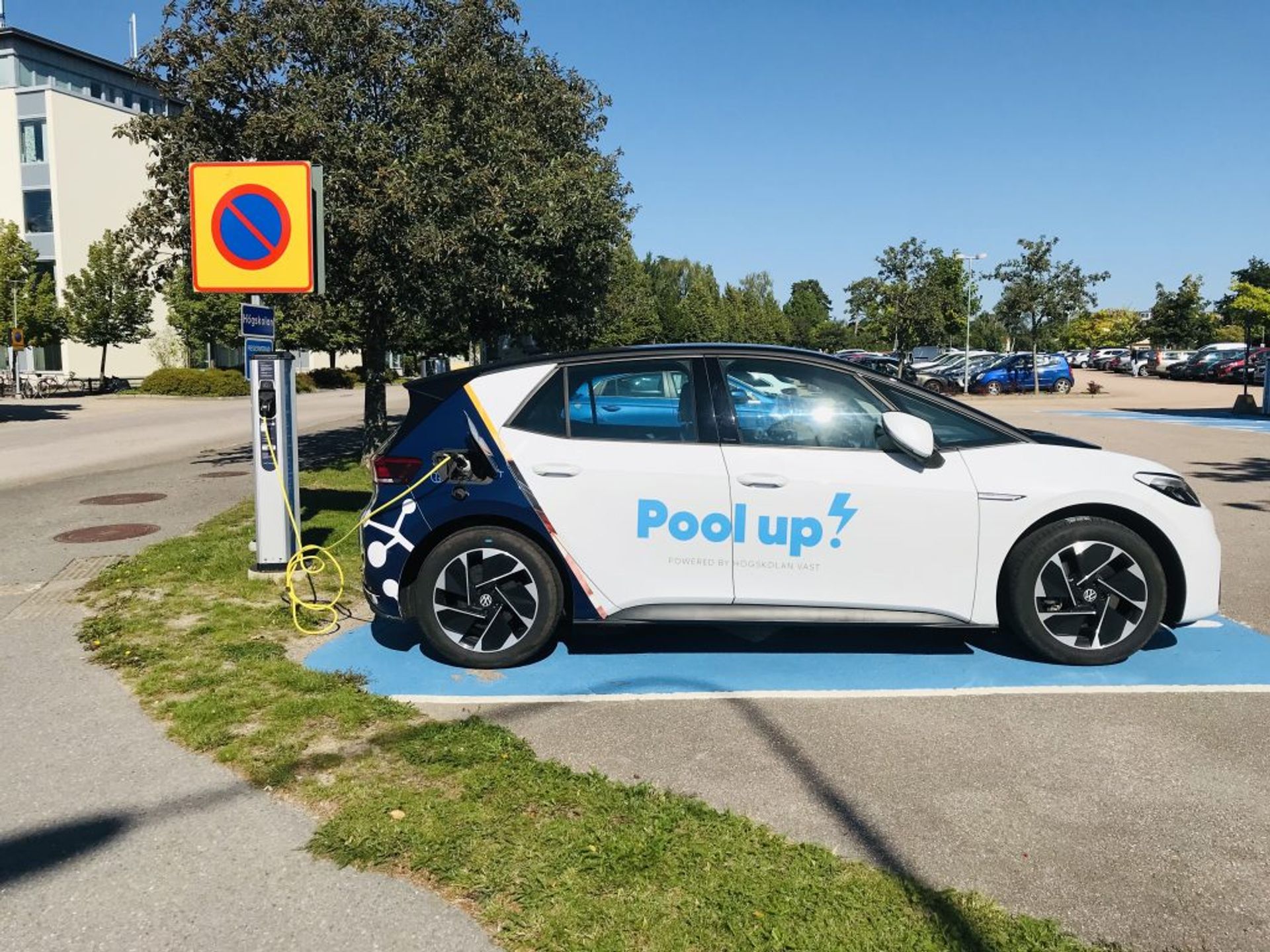 Electric car charging in a school parking lot