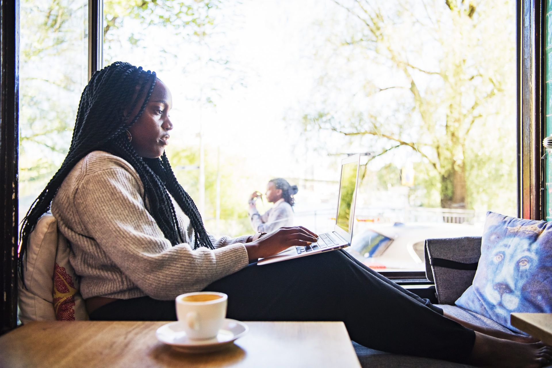 Female student working using a laptop