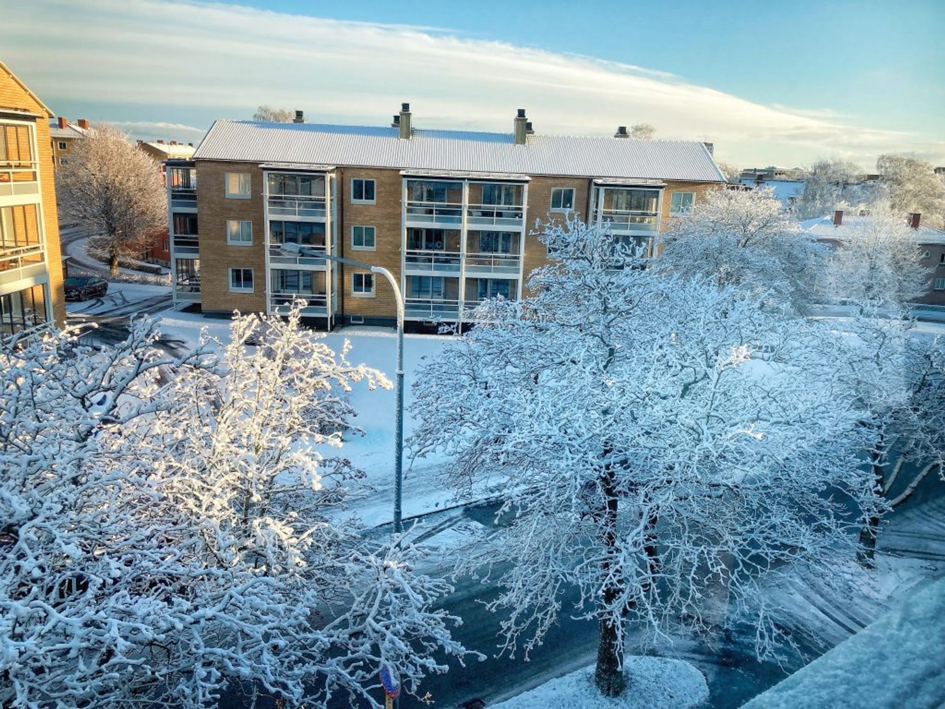 A snowy city behind a window. 