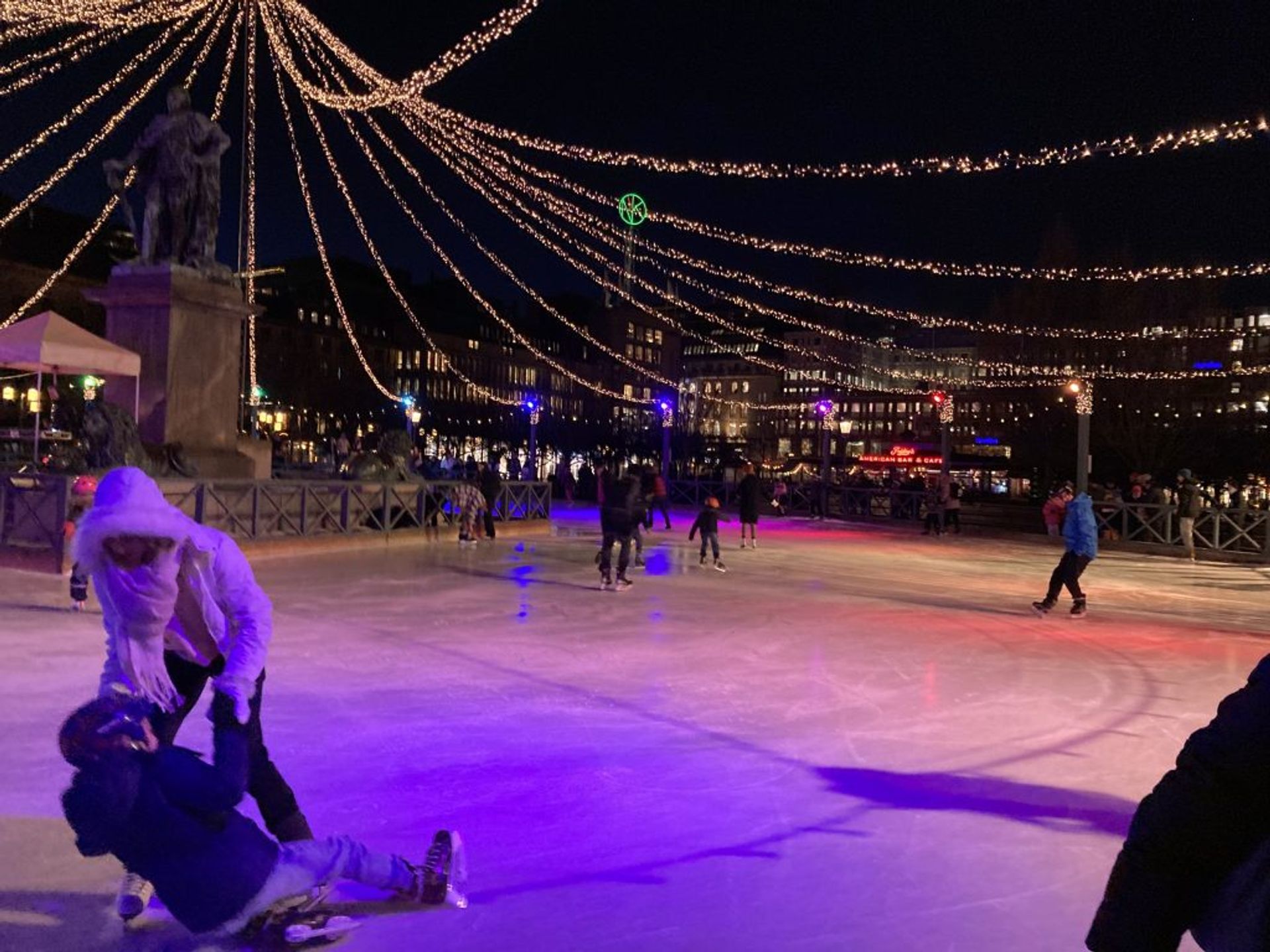 A person about to fall on an ice rink in Stockholm. 