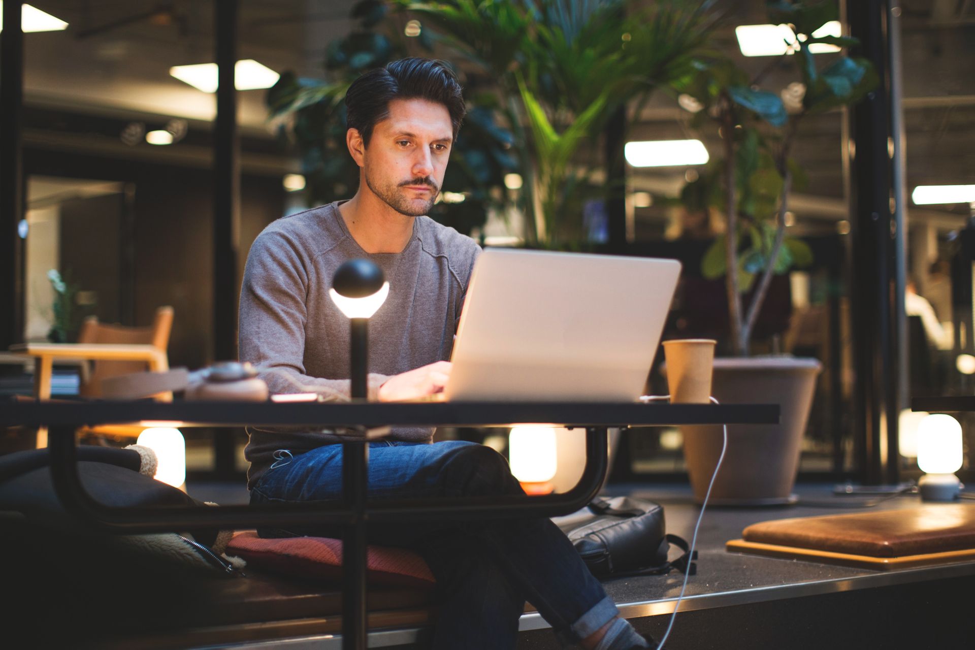 man sitting at computer 