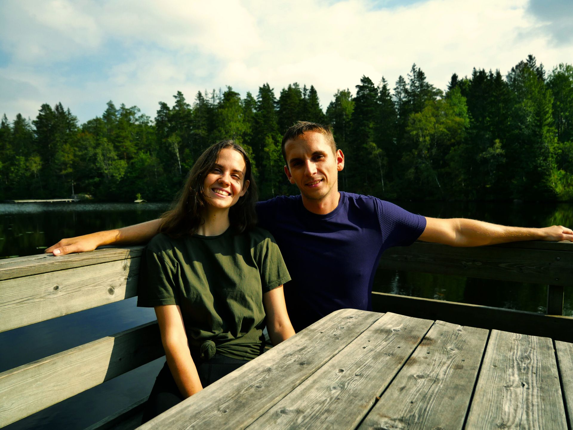 Couple with a lake at the background