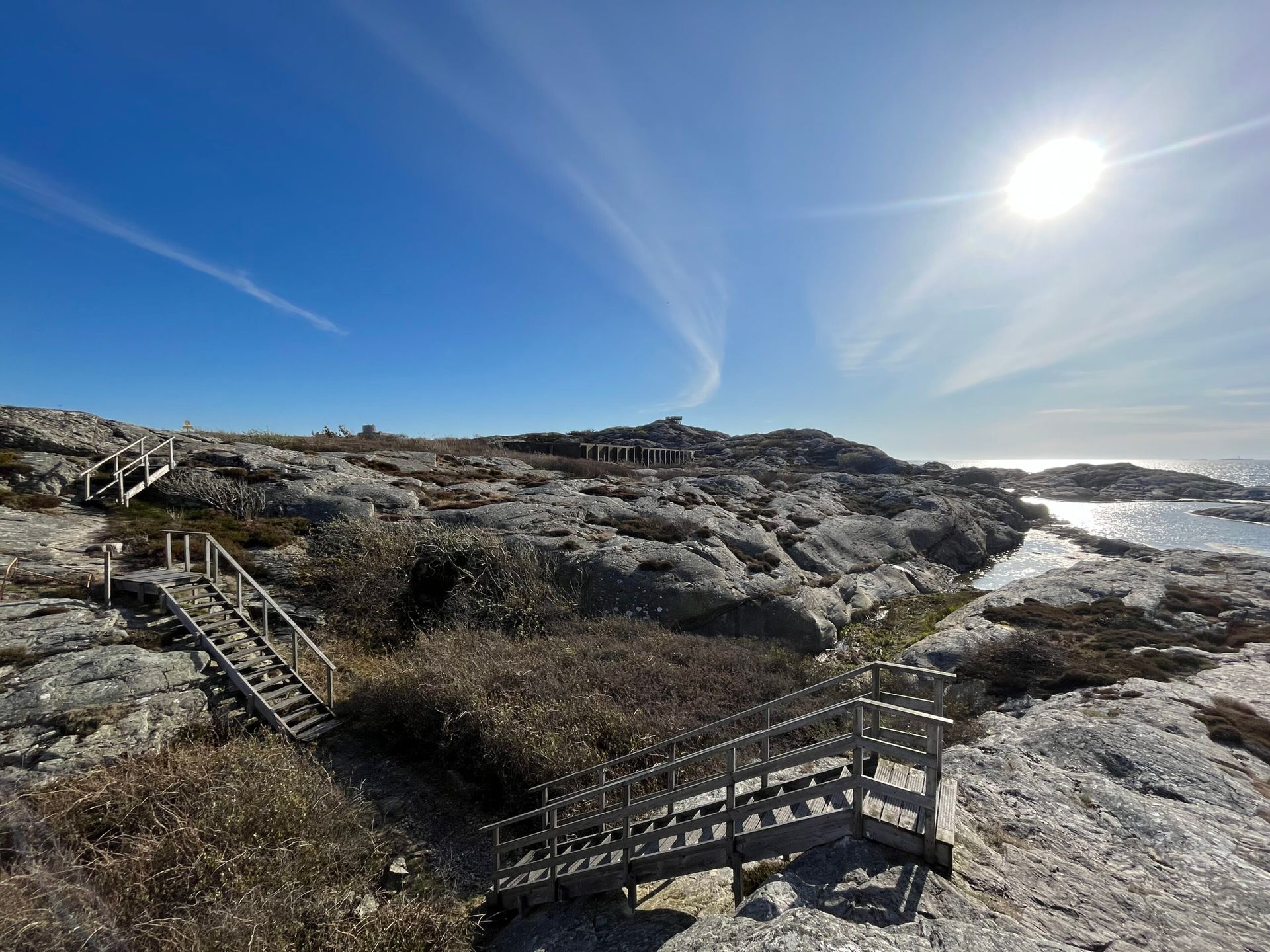 A panoramic view of seaside cliffs and rocky terrain.