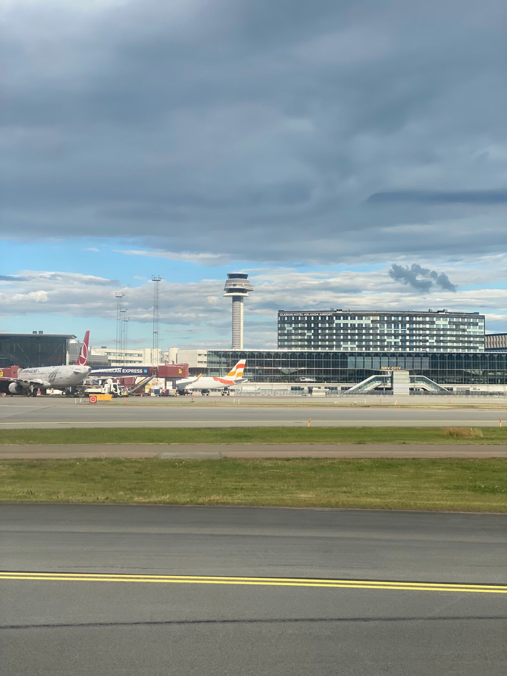 A perspective from an aircraft window as it approaches the terminals of Arlanda Airport after landing.