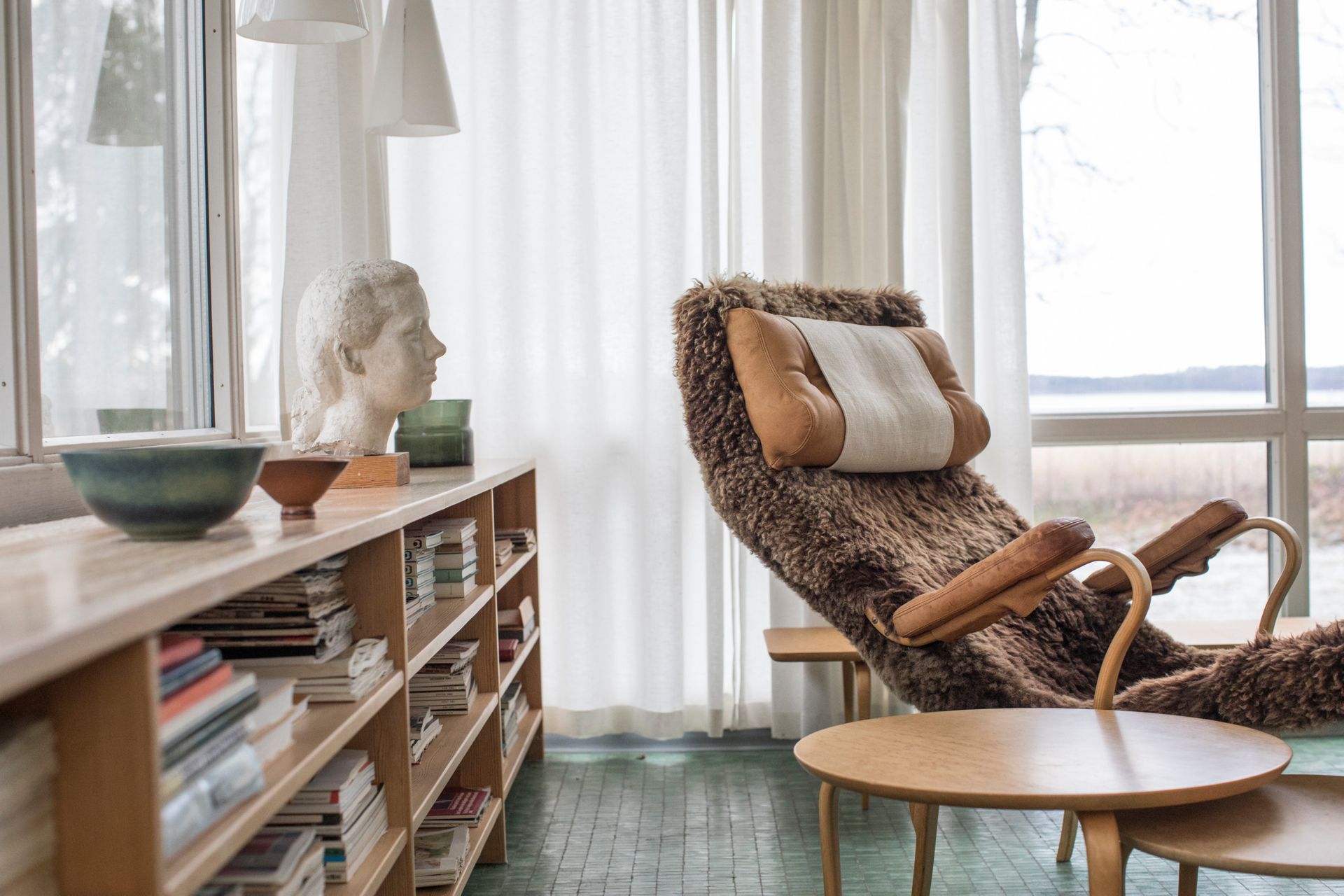 A cozy reading nook by a large window with natural light.