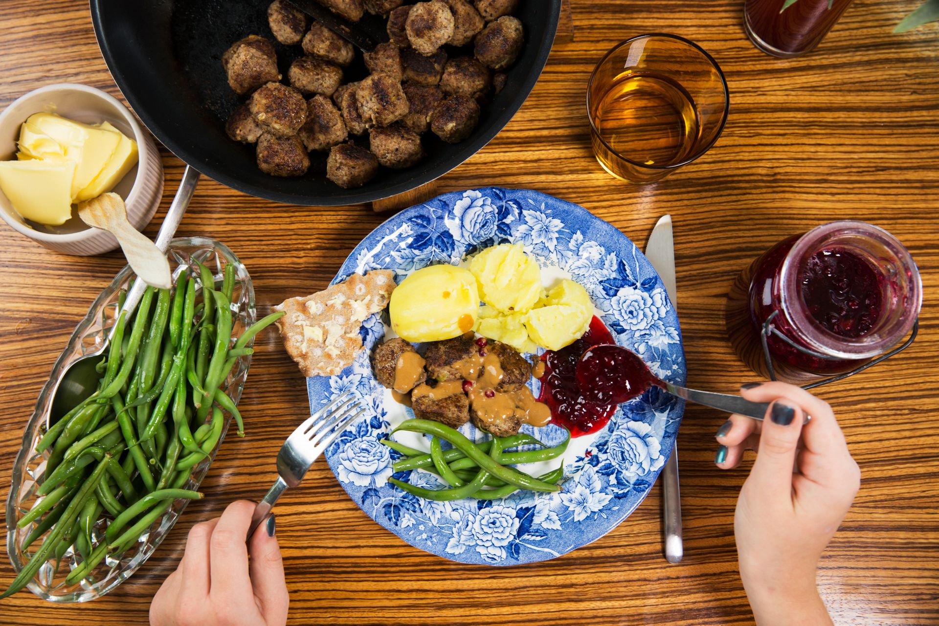 Swedish meatballs with green beans, mashed potatoes, and cranberry sauce. 