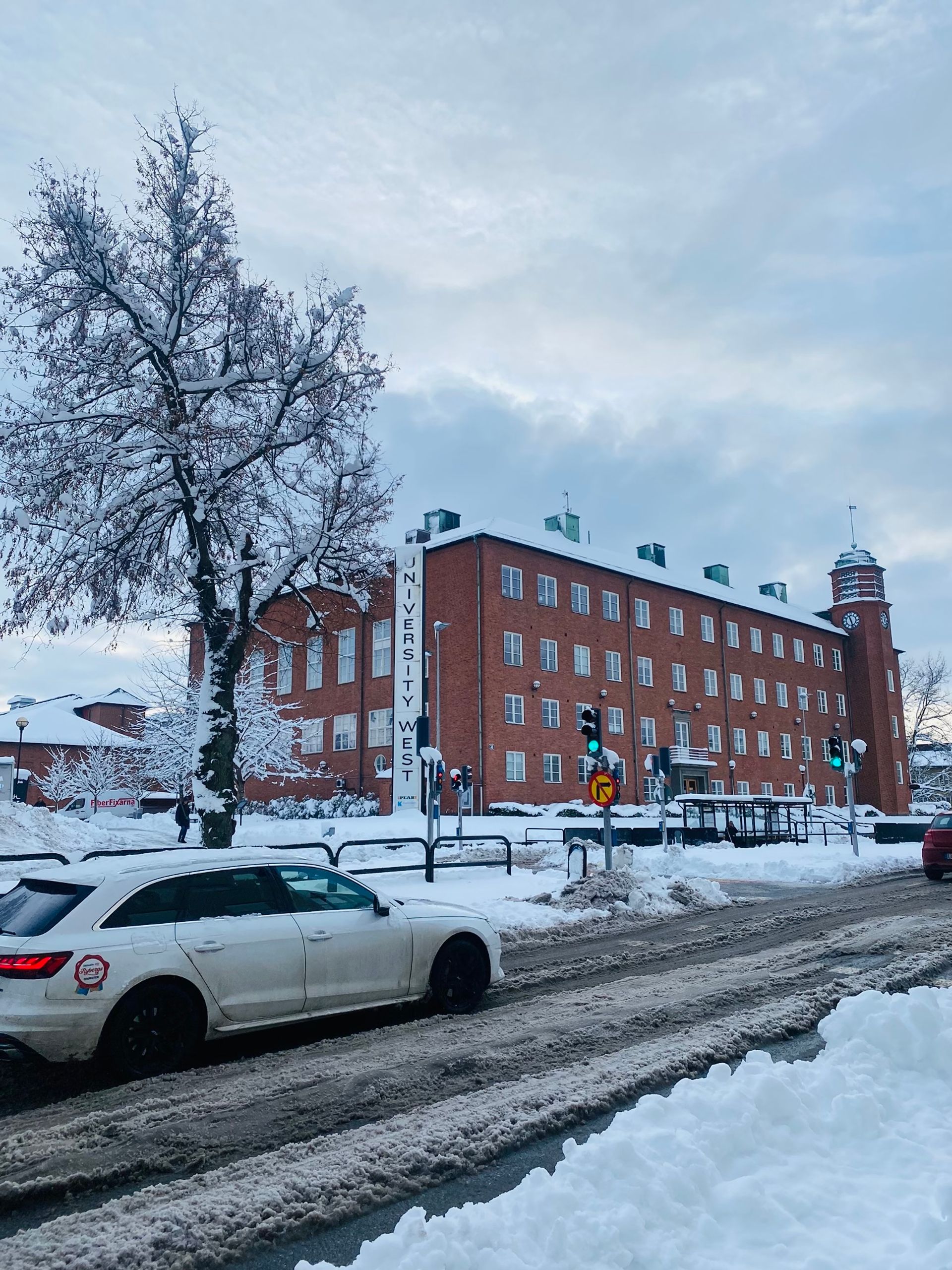 A roadside view of University West during winter.