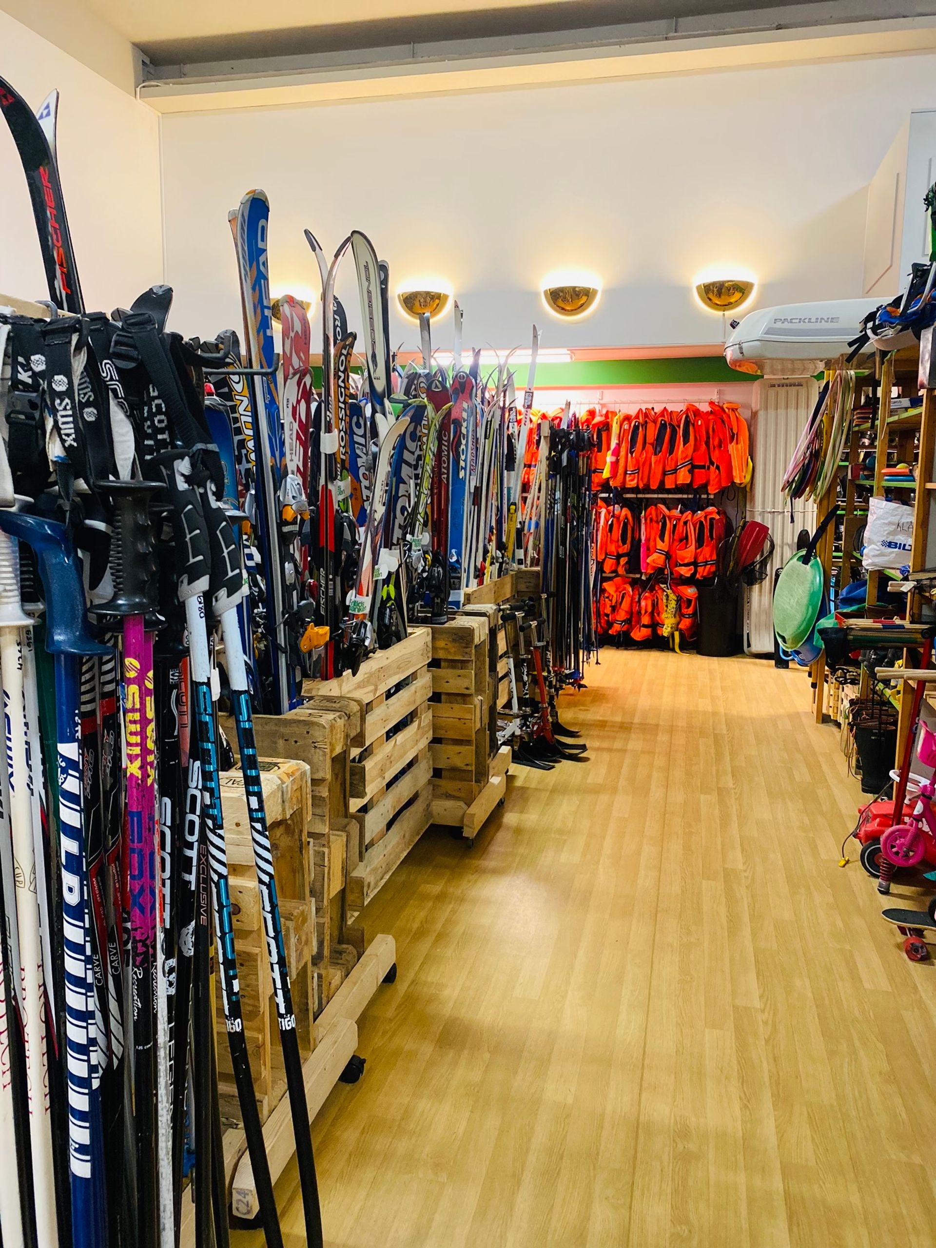 Shelves at Fritidsbanken display a diverse array of sporting equipment.