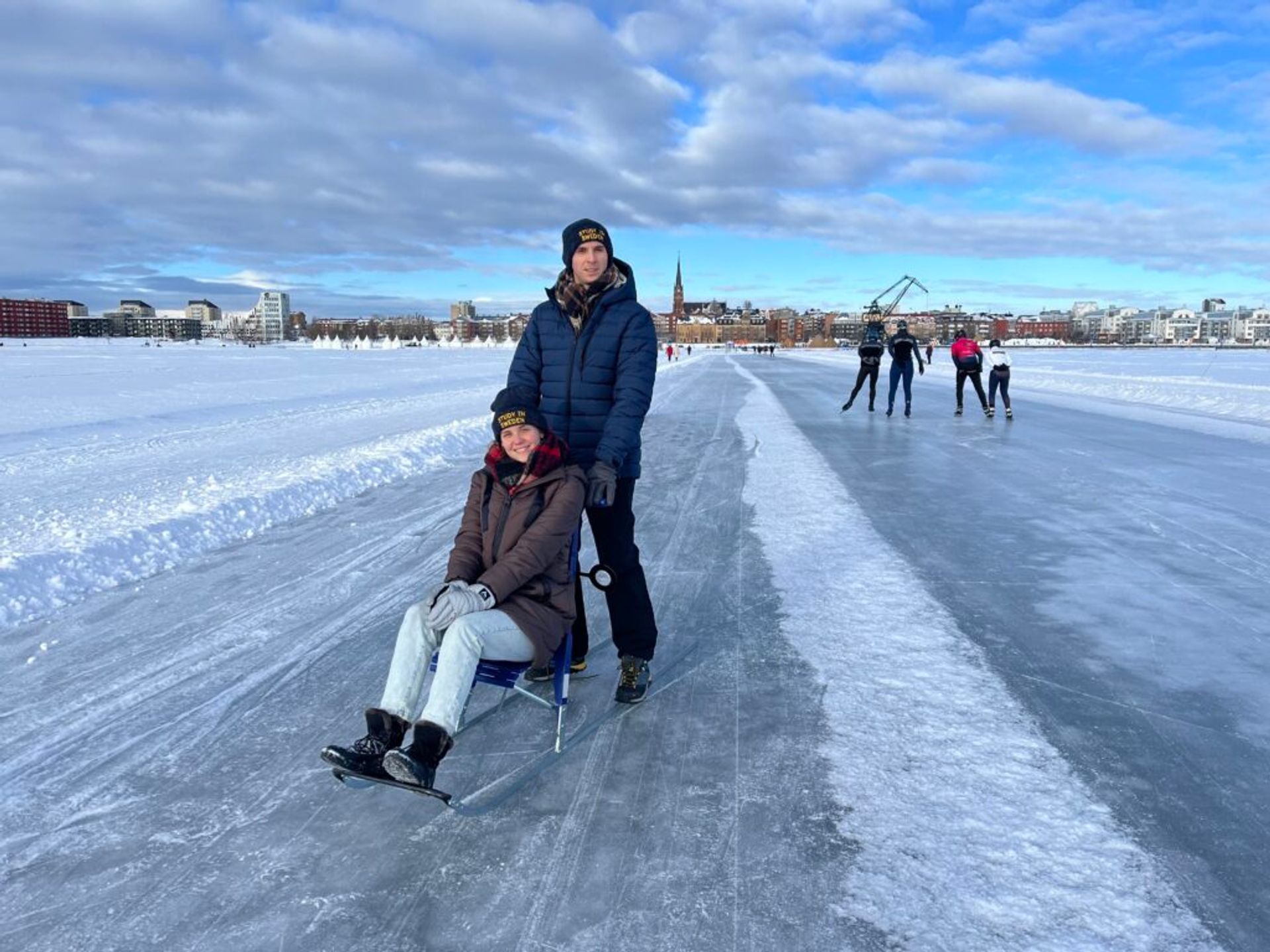 A couple on an ice track.