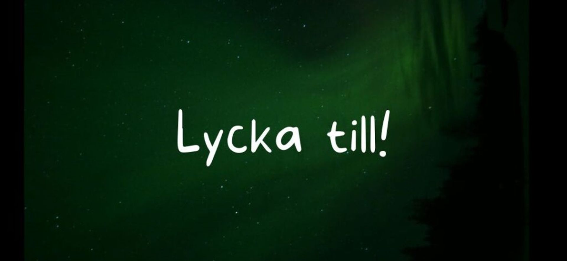 Northern lights with Lycka till! written over the picture. 