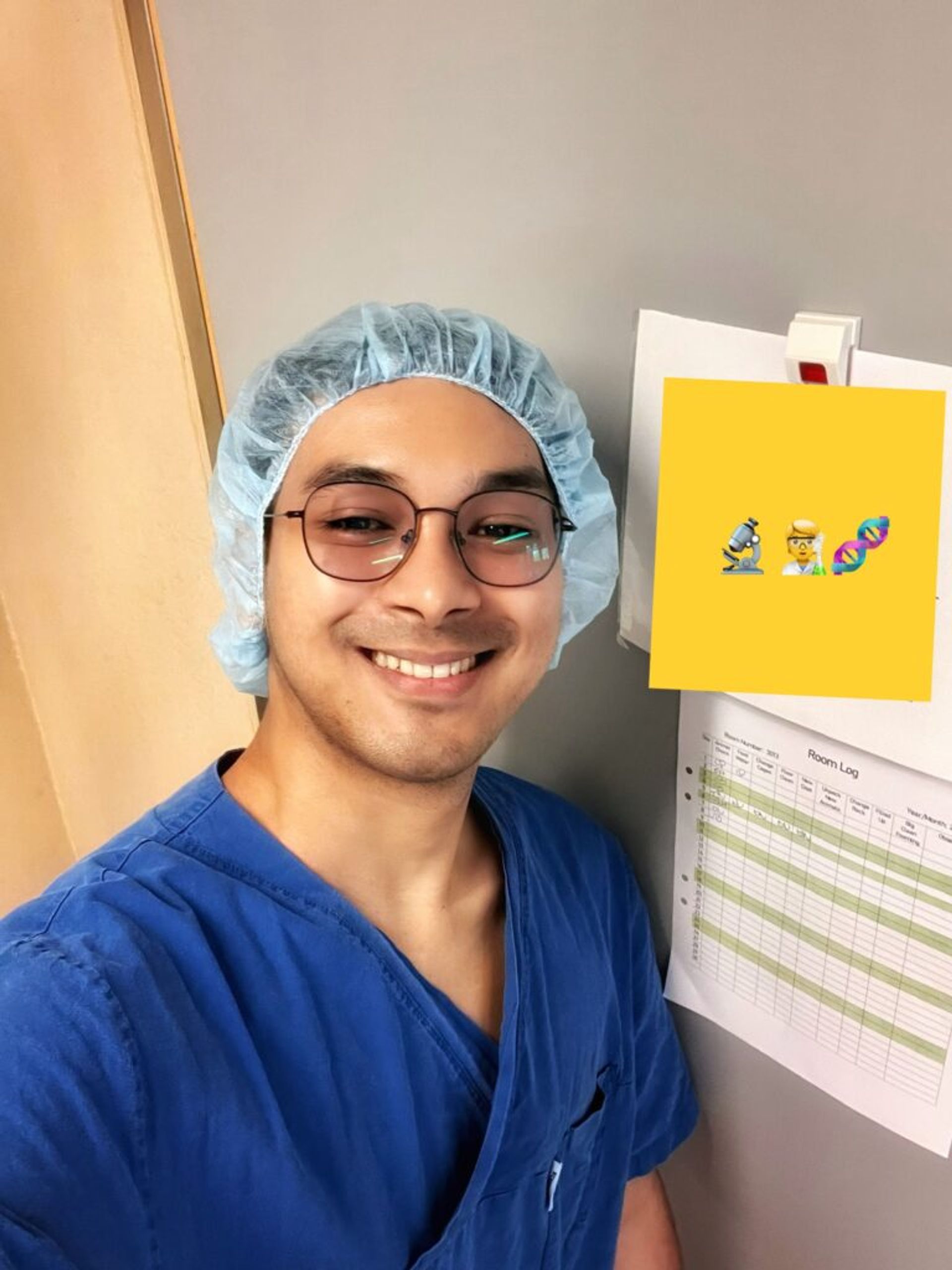 A picture of TJ, Masters student at his workplace smiling