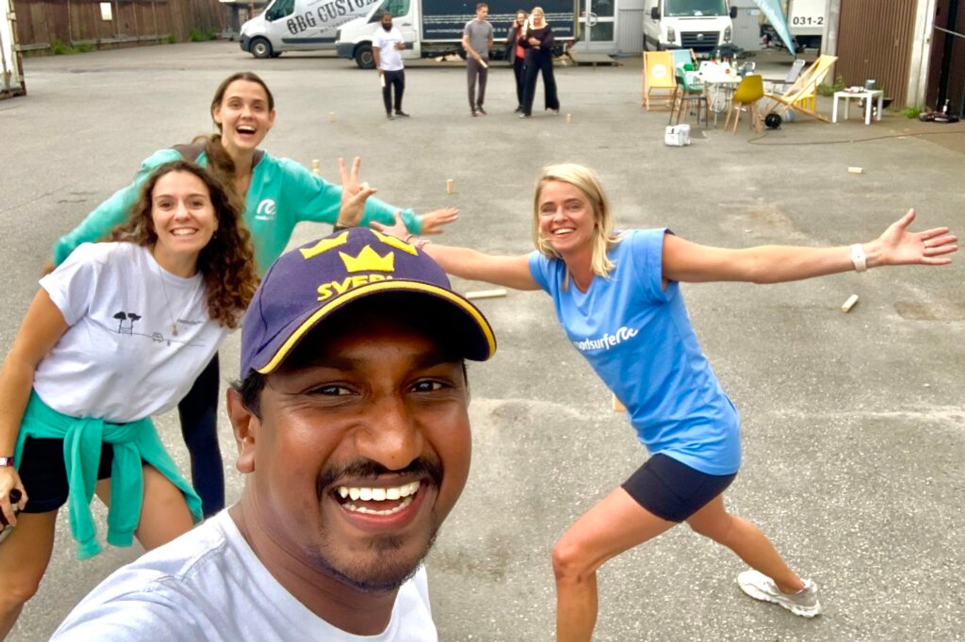 A group selfie of people smiling in sportswear.