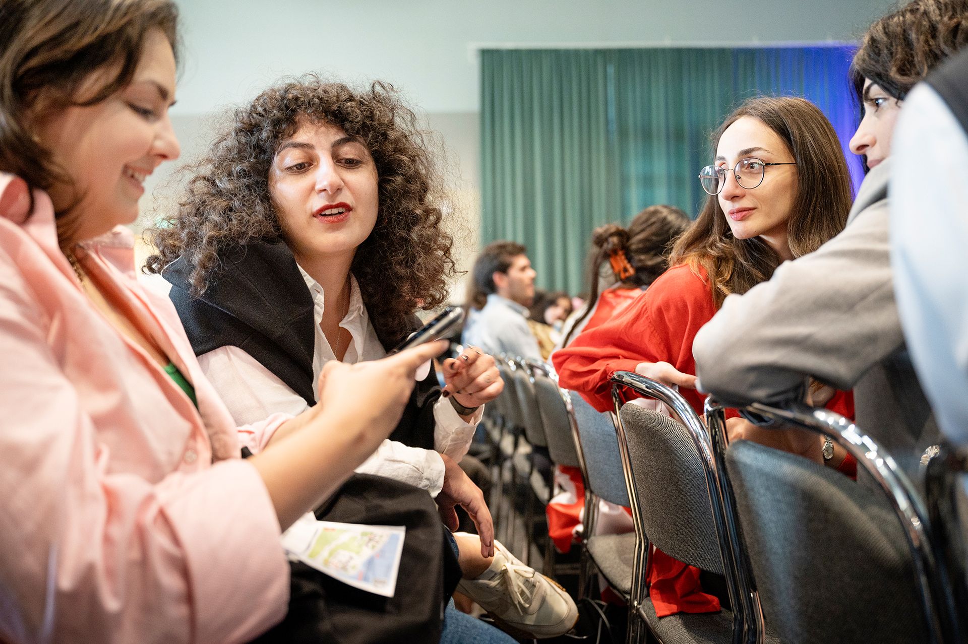 A group of students engaged in conversation.