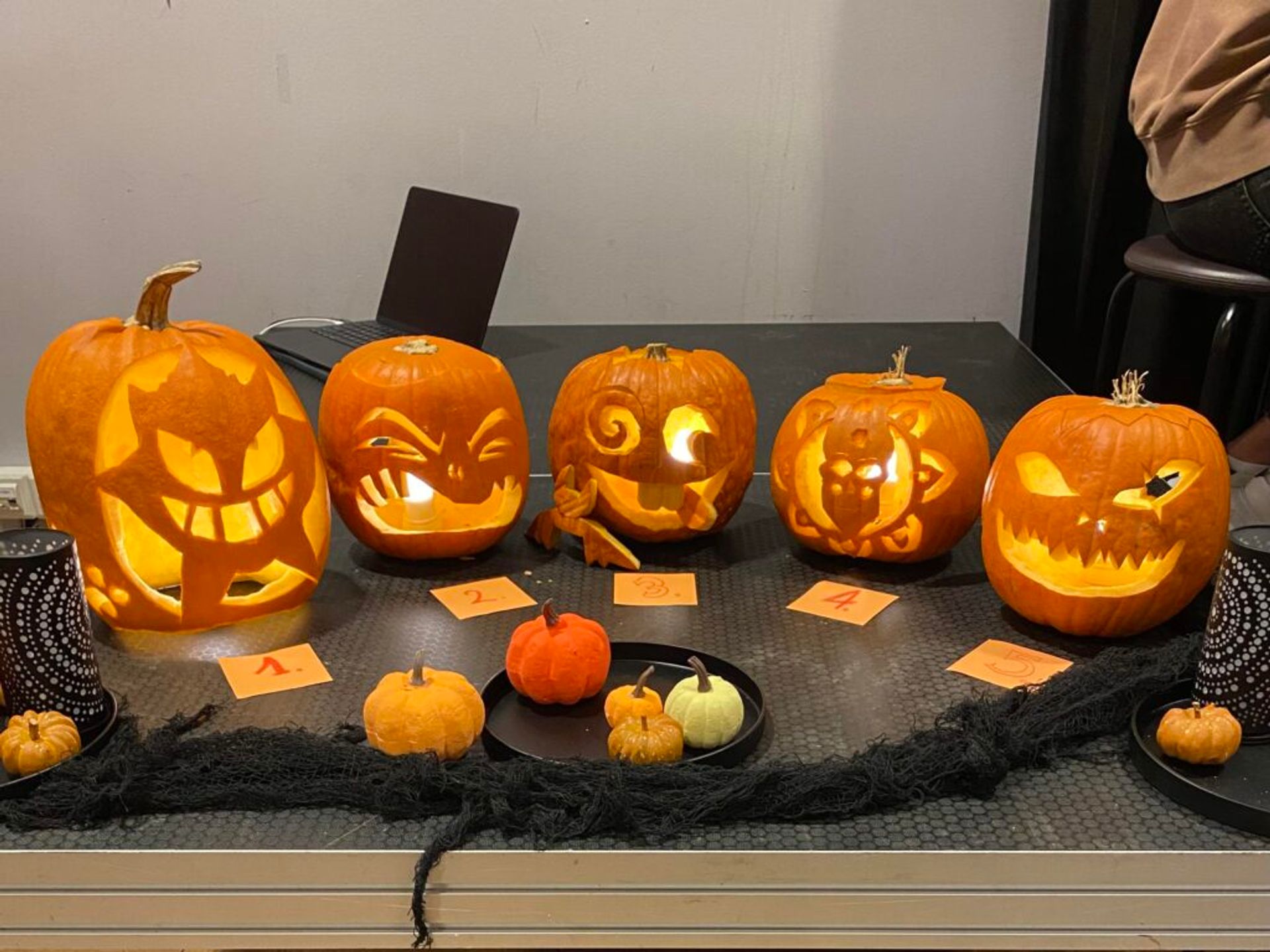 Various Jack-O’-Lanterns on display for Halloween.