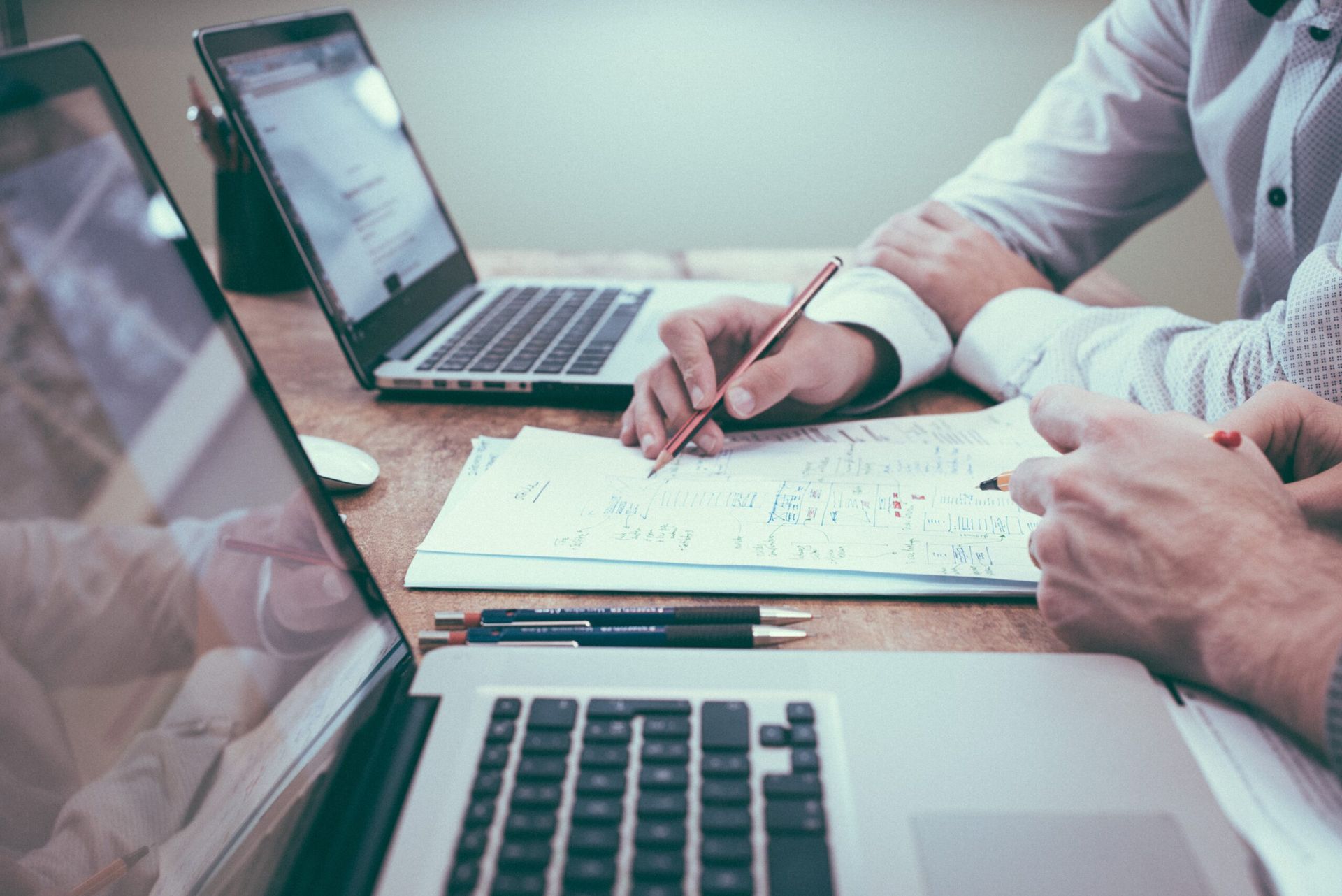 A close-up of two people in a dynamic work session.