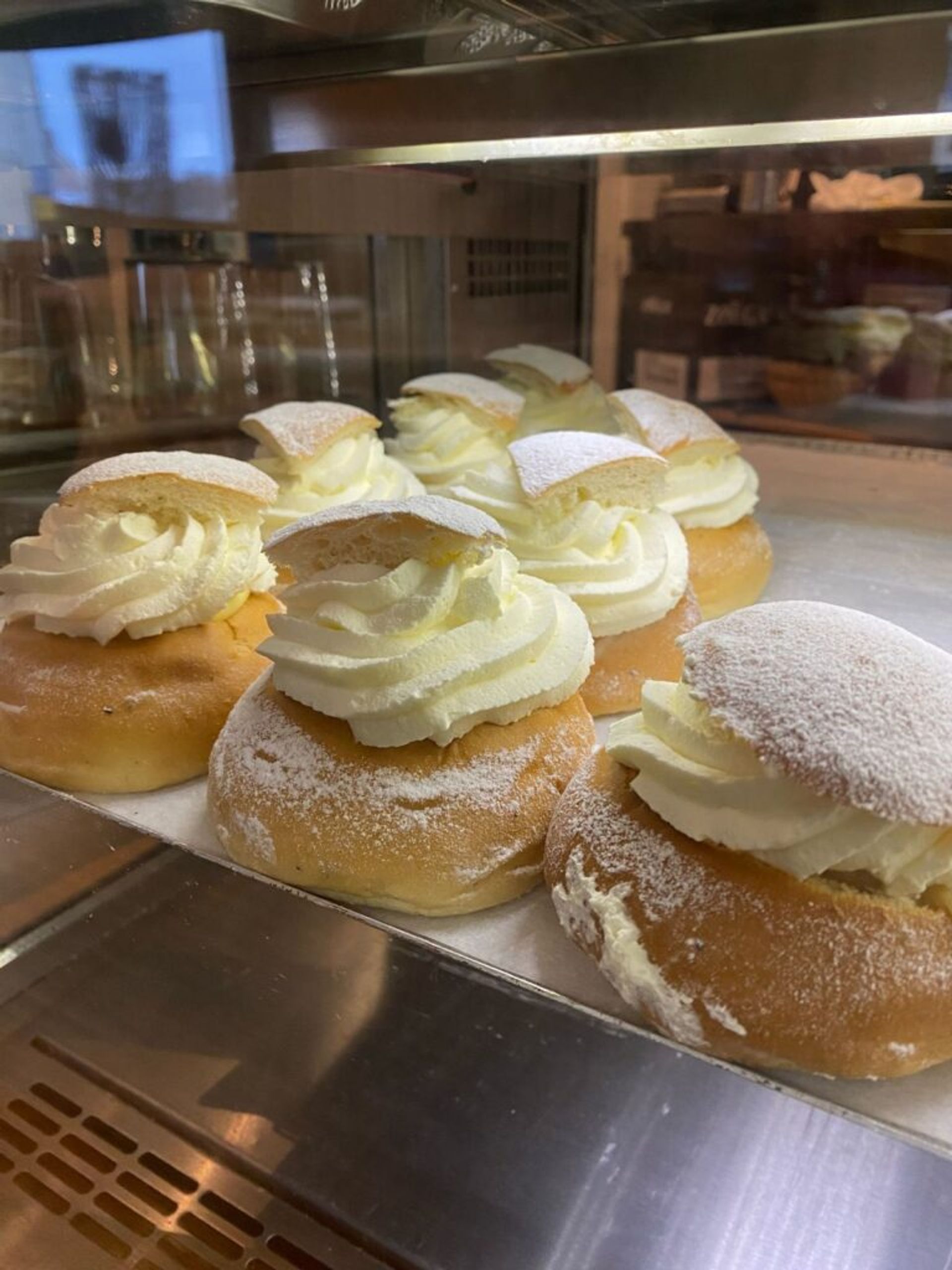 Semlor or semla buns on the display of a bakery in Sweden