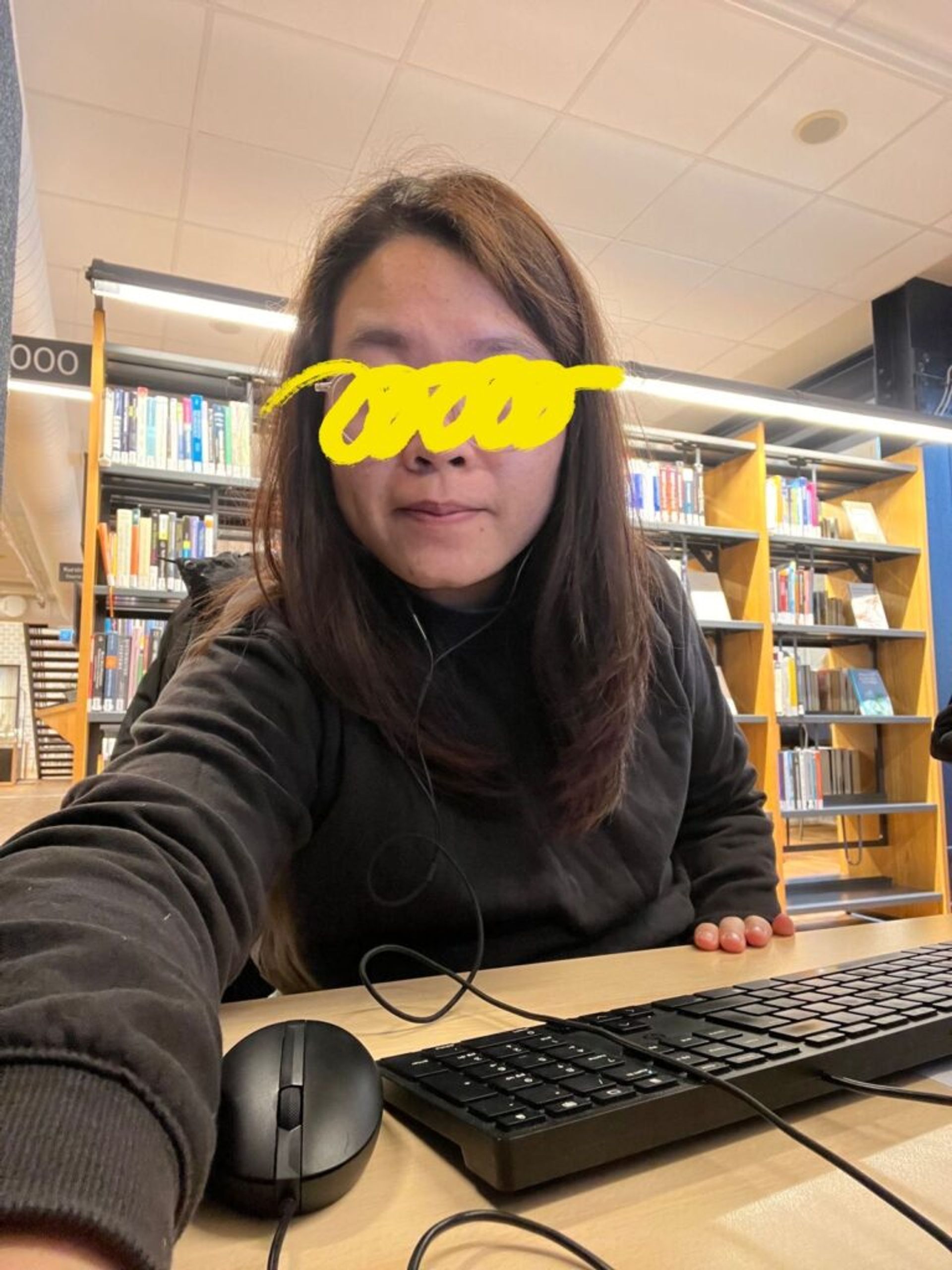 An international student from Vietnam in a university library.