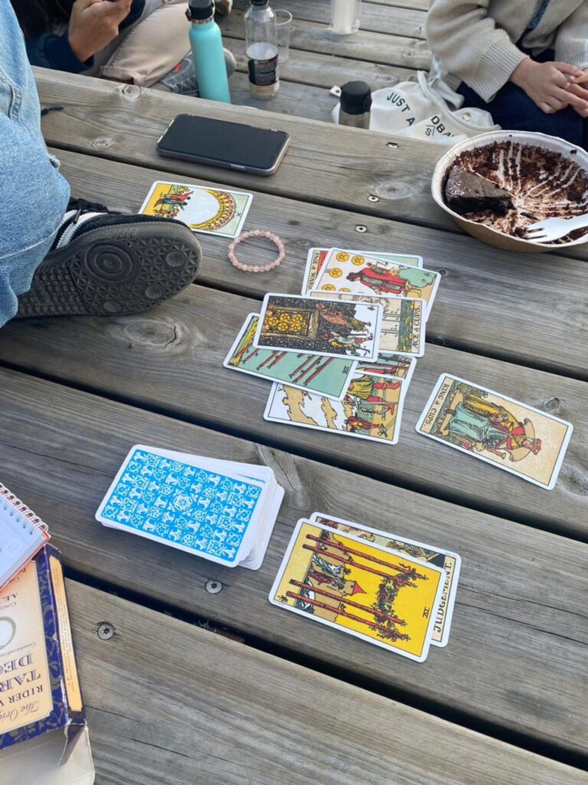 International students doing a tarot card reading with friends.